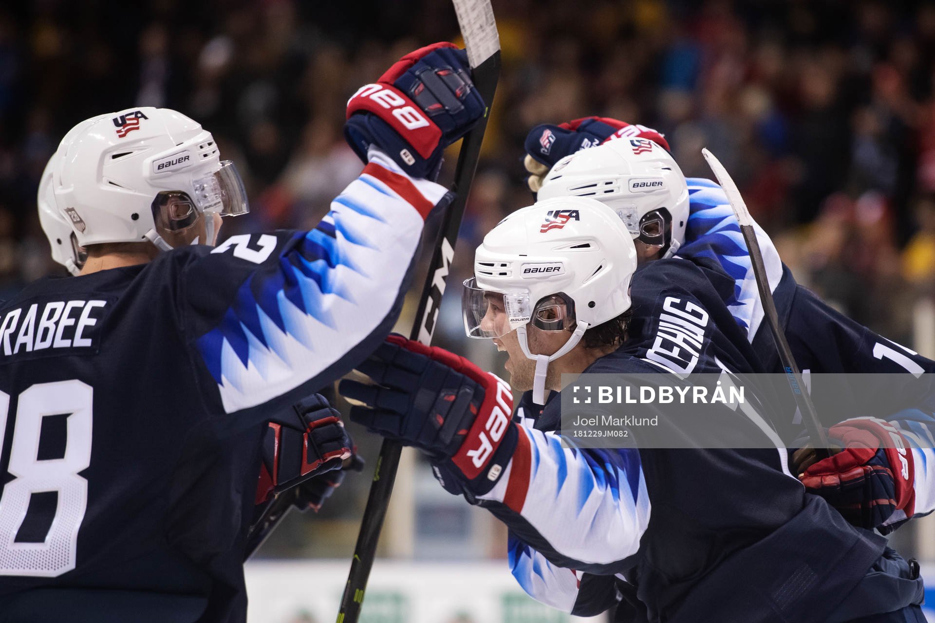 Ryan Poehling of USA celebrates with teammates