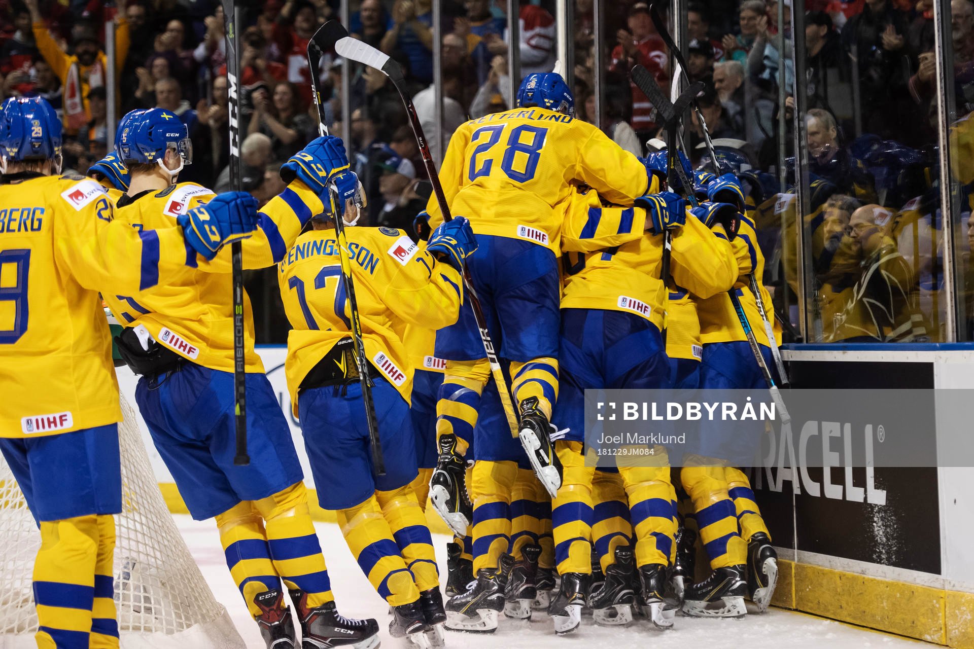 Players of team Sweden celebrate the game winning 5-4 goal