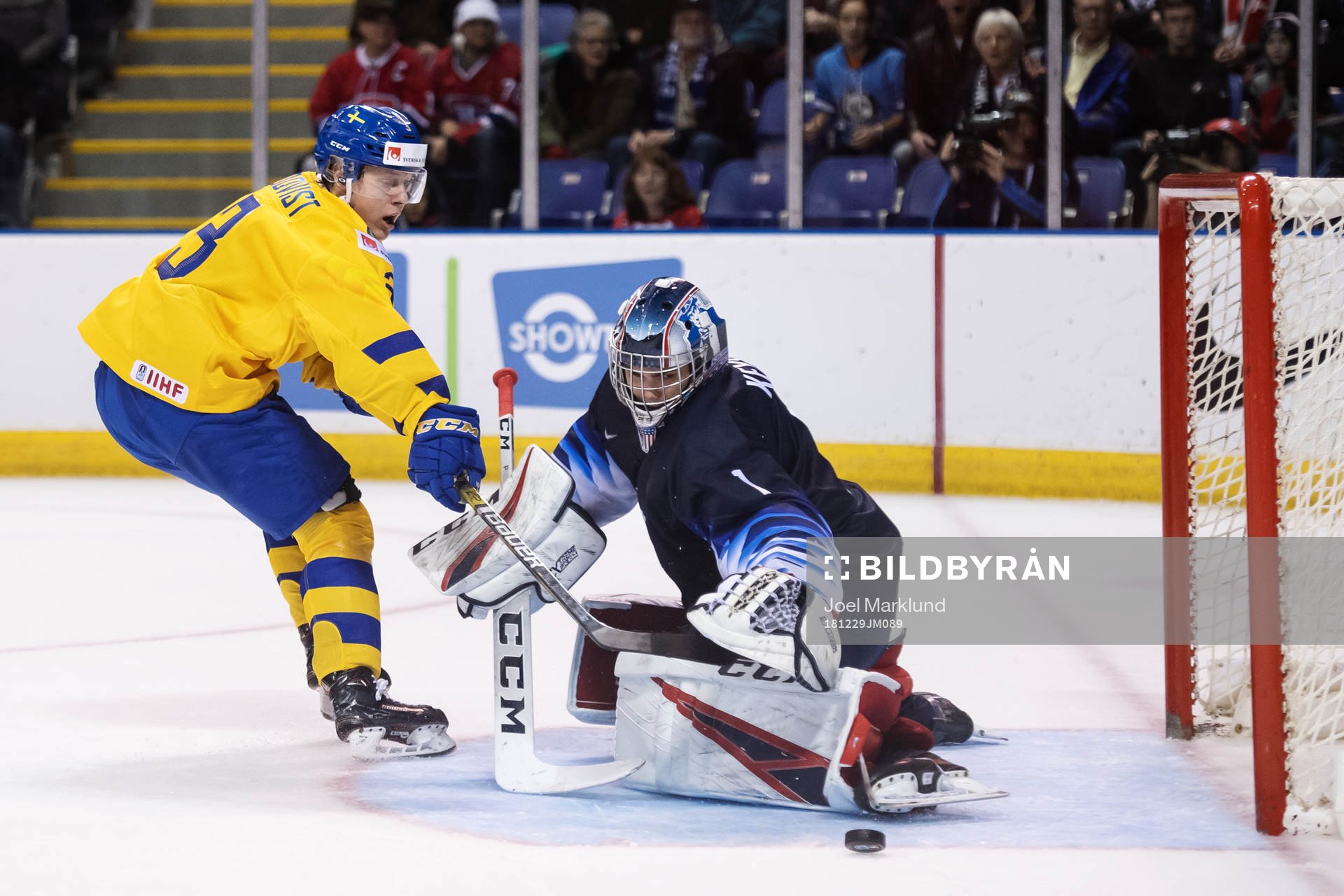 Adam Boqvist of Sweden in action against goaltender Kyle