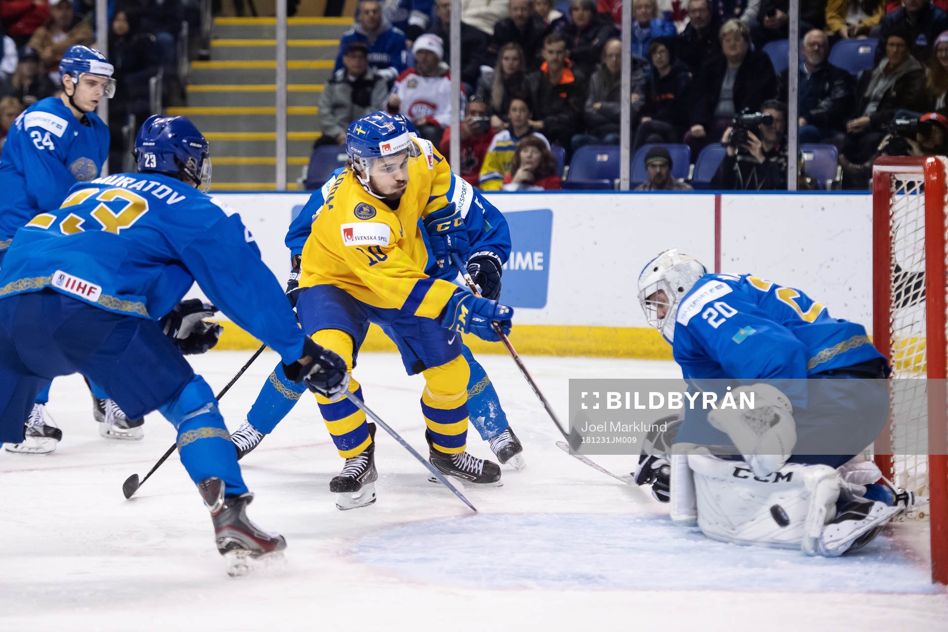 Emil Bemström of Sweden shoots at goaltender Denis