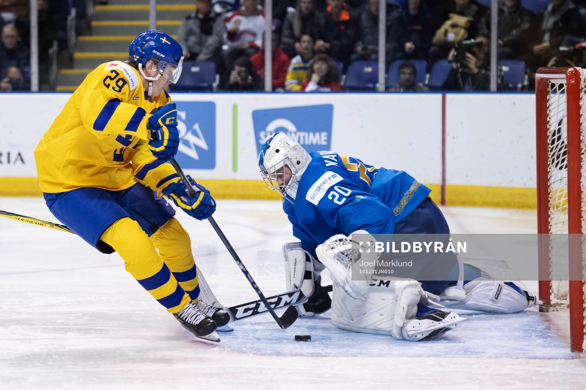 Pontus Holmberg of Sweden in action against goaltender