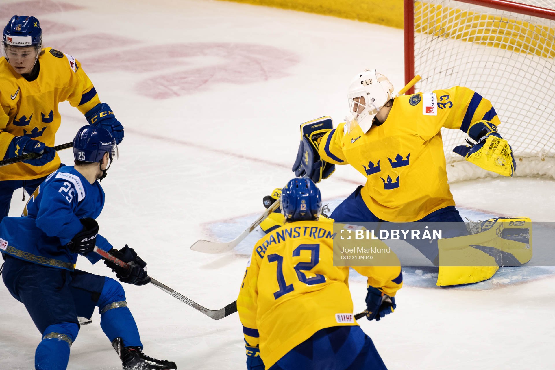 Goaltender Olle Eriksson Ek of Sweden makes a save