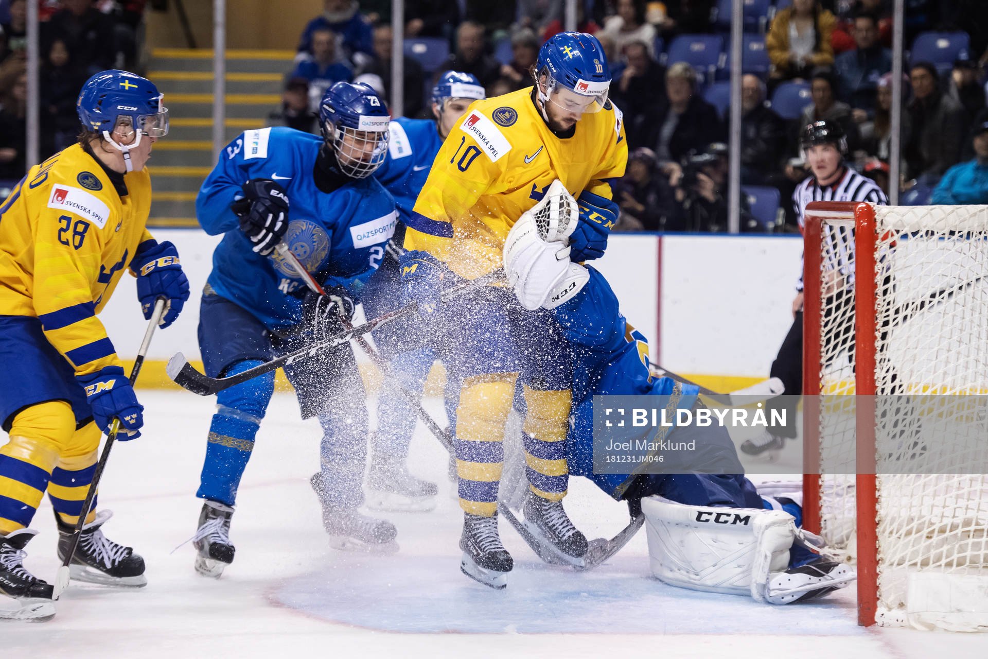 Emil Bemström of Sweden in action against goaltender Denis