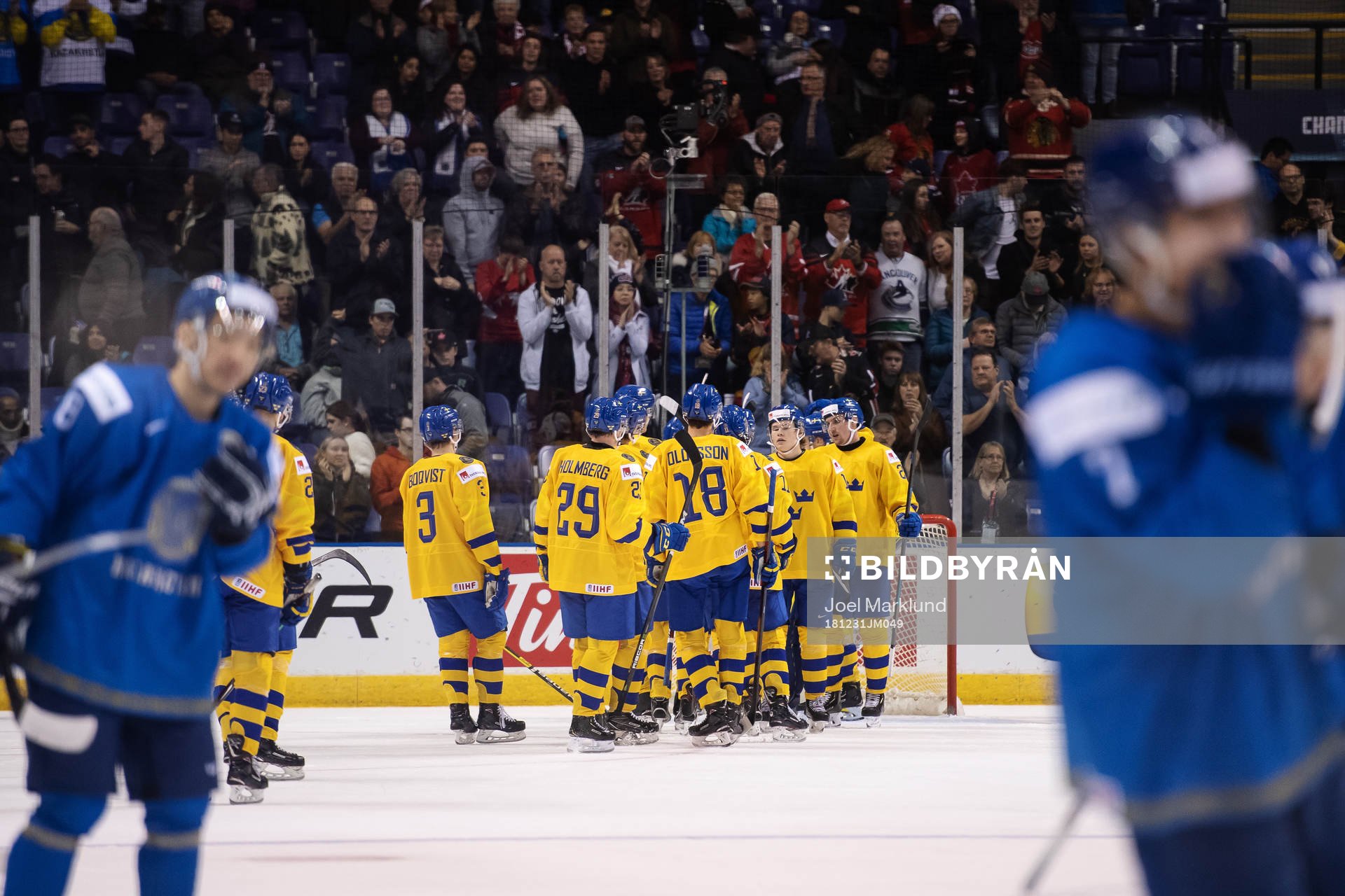 Players of team Sweden celebrate their win