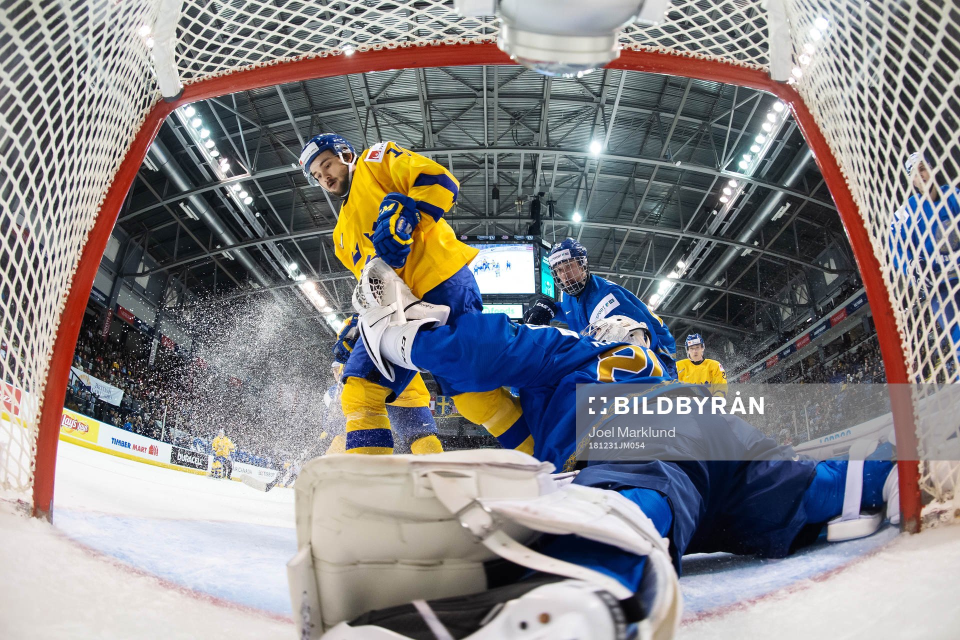 Goaltender Denis Karatayev of Kazakhstan stops the puck in