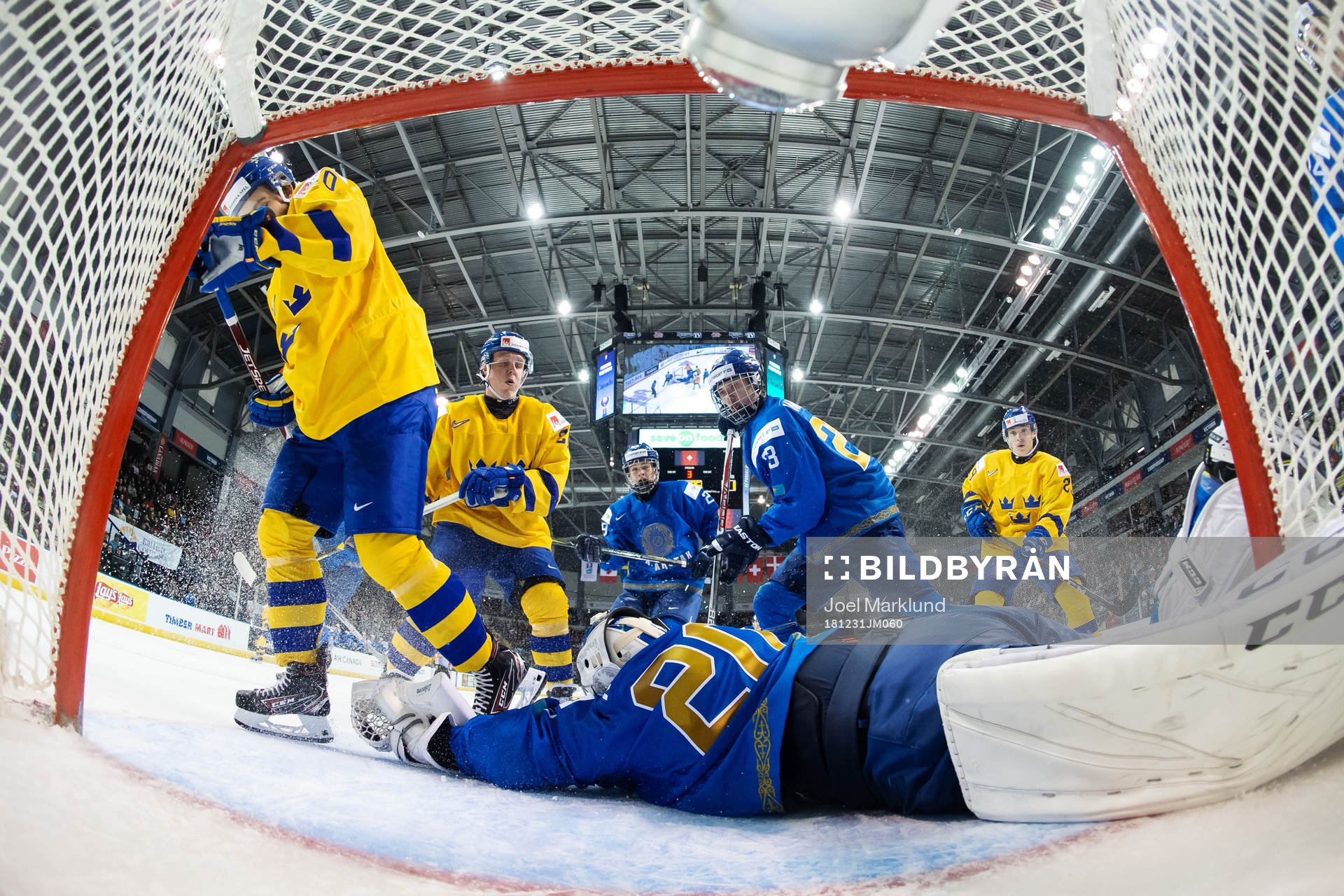 Goaltender Denis Karatayev of Kazakhstan stretches for the
