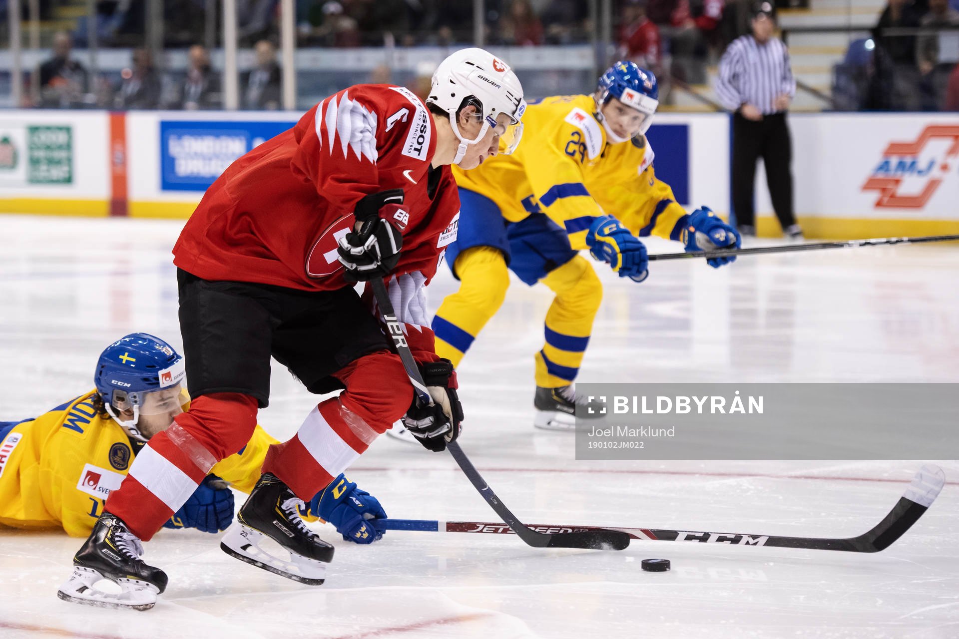 Marco Lehmann of Switzerland dribbles past Lucas Elvenes of