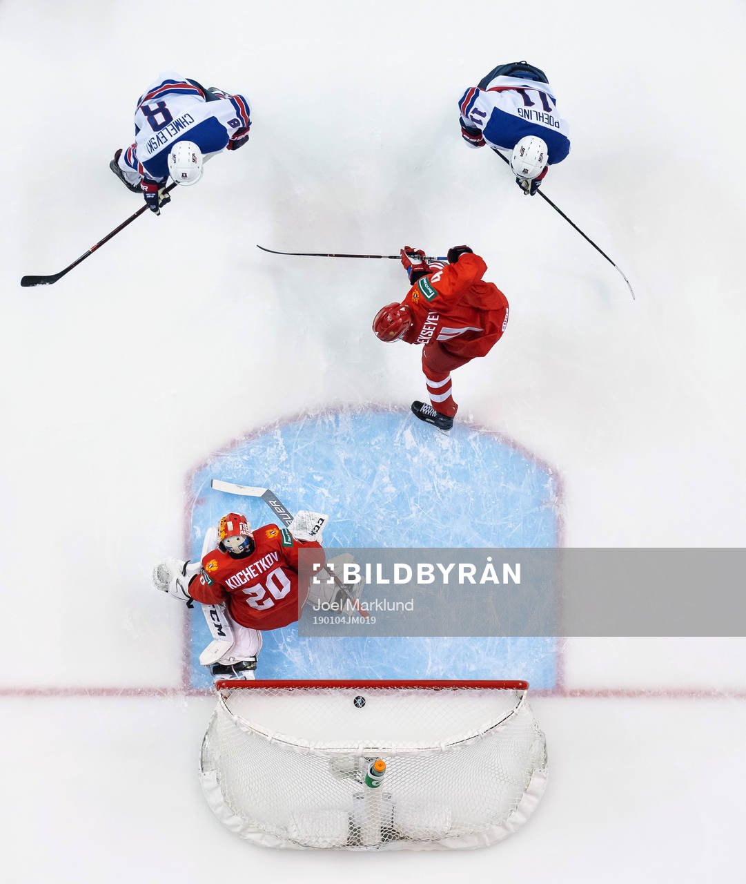 Alexander Chmelevski of USA scores 0-2 behind goaltender