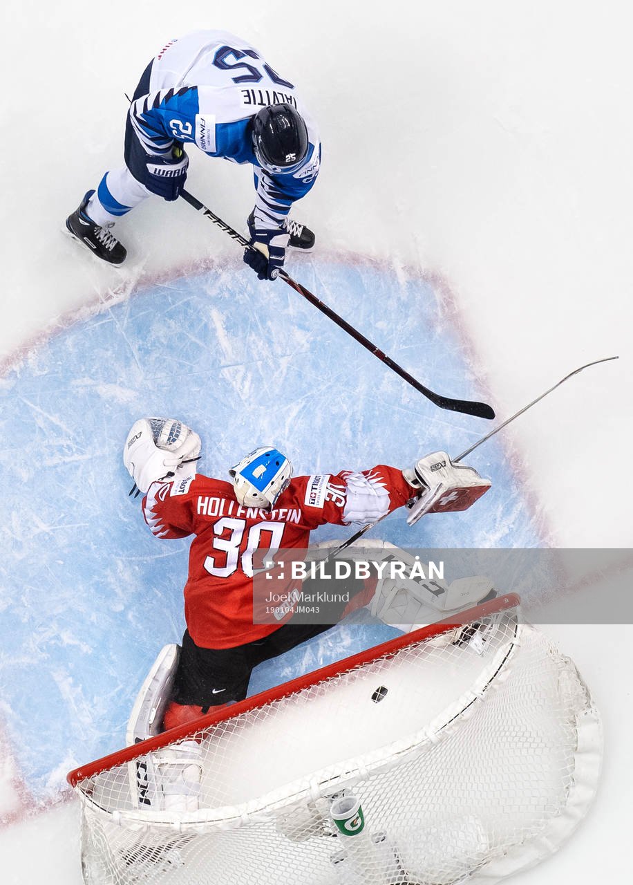 Aarne Talvitie of Finland scores 2-0 behind goaltender Luca
