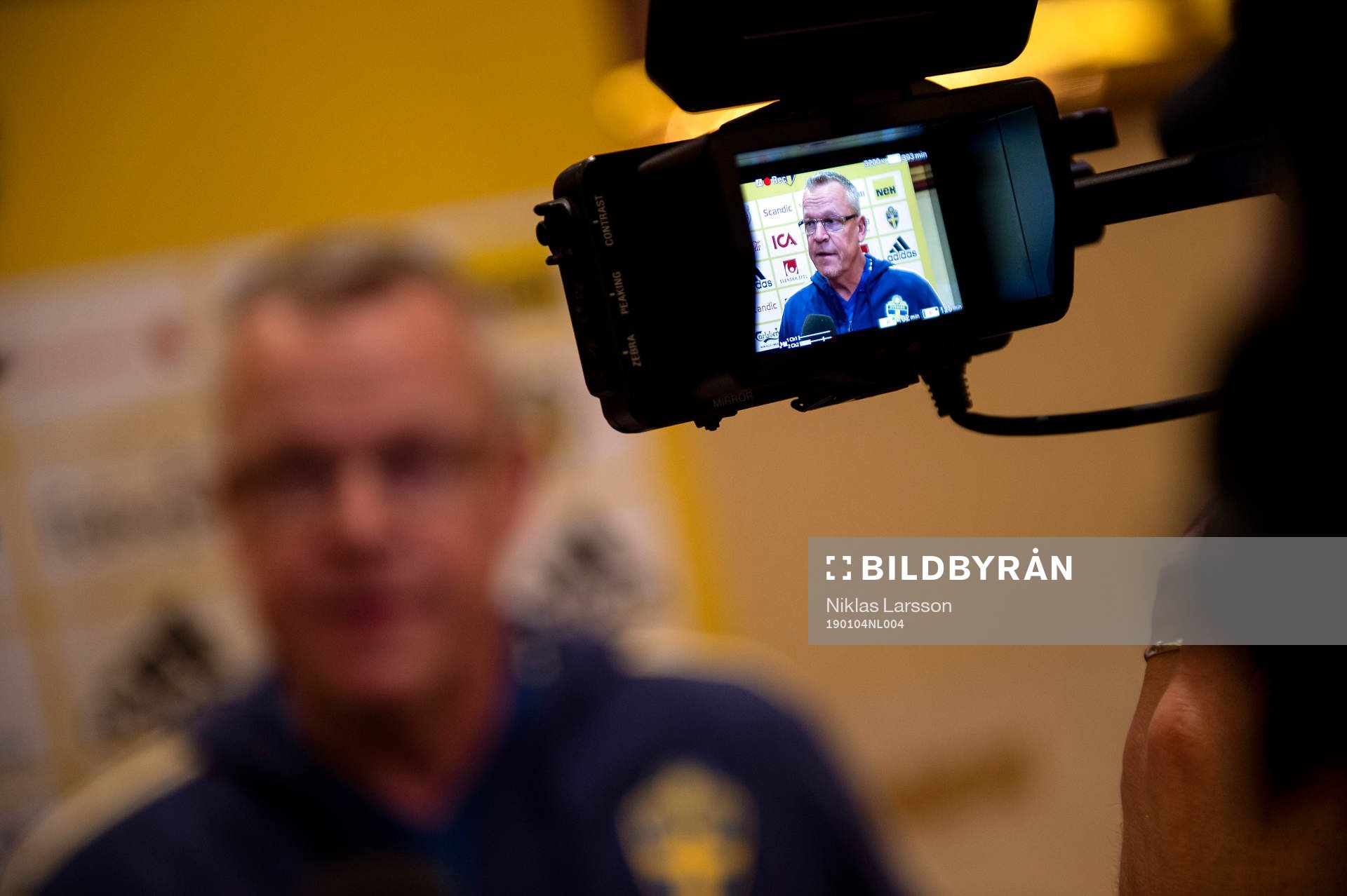 Head coach Janne Andersson of Sweden is shown trough a