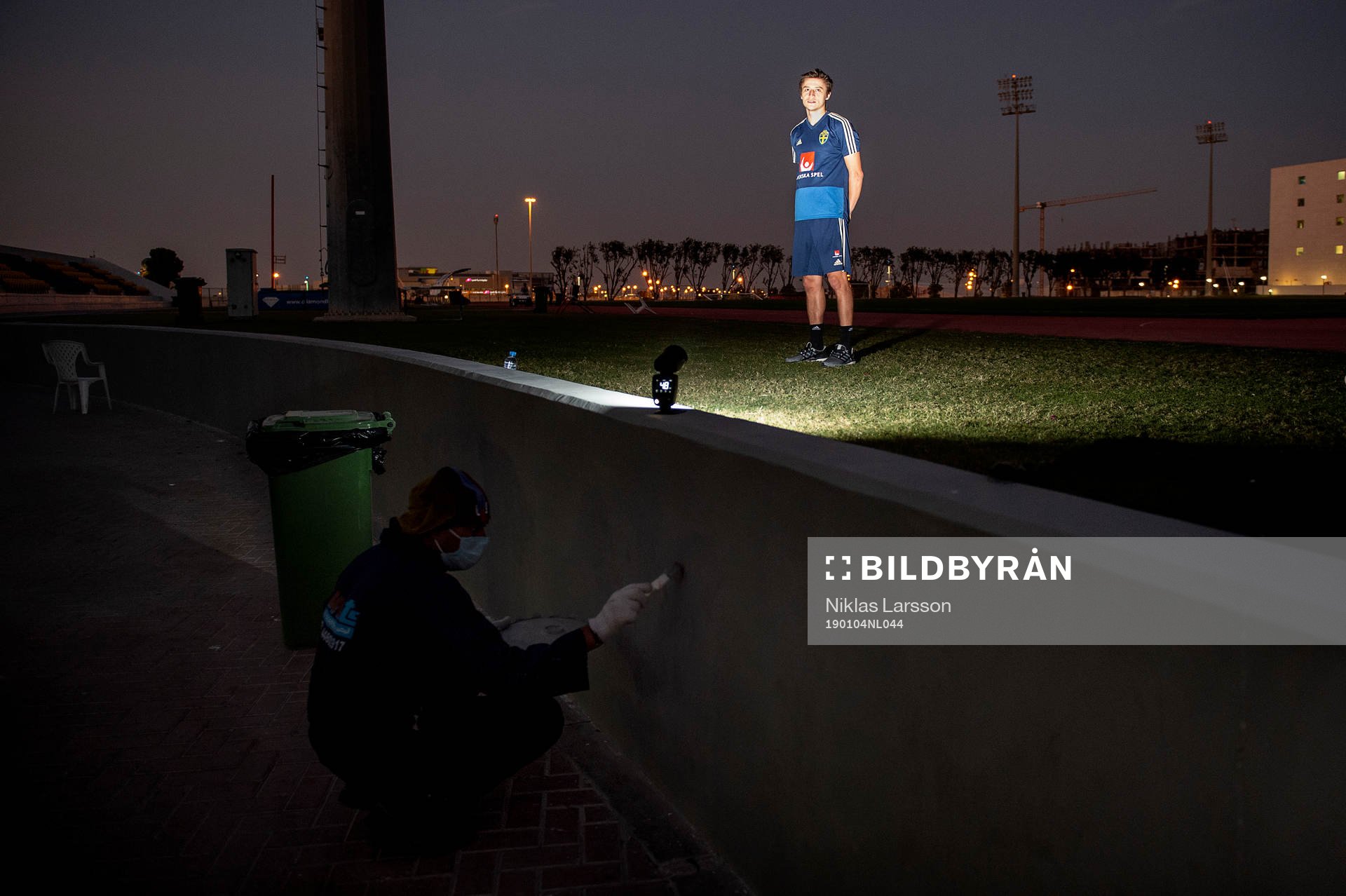 Sweden's Simon Thern poses for a portrait and a worker