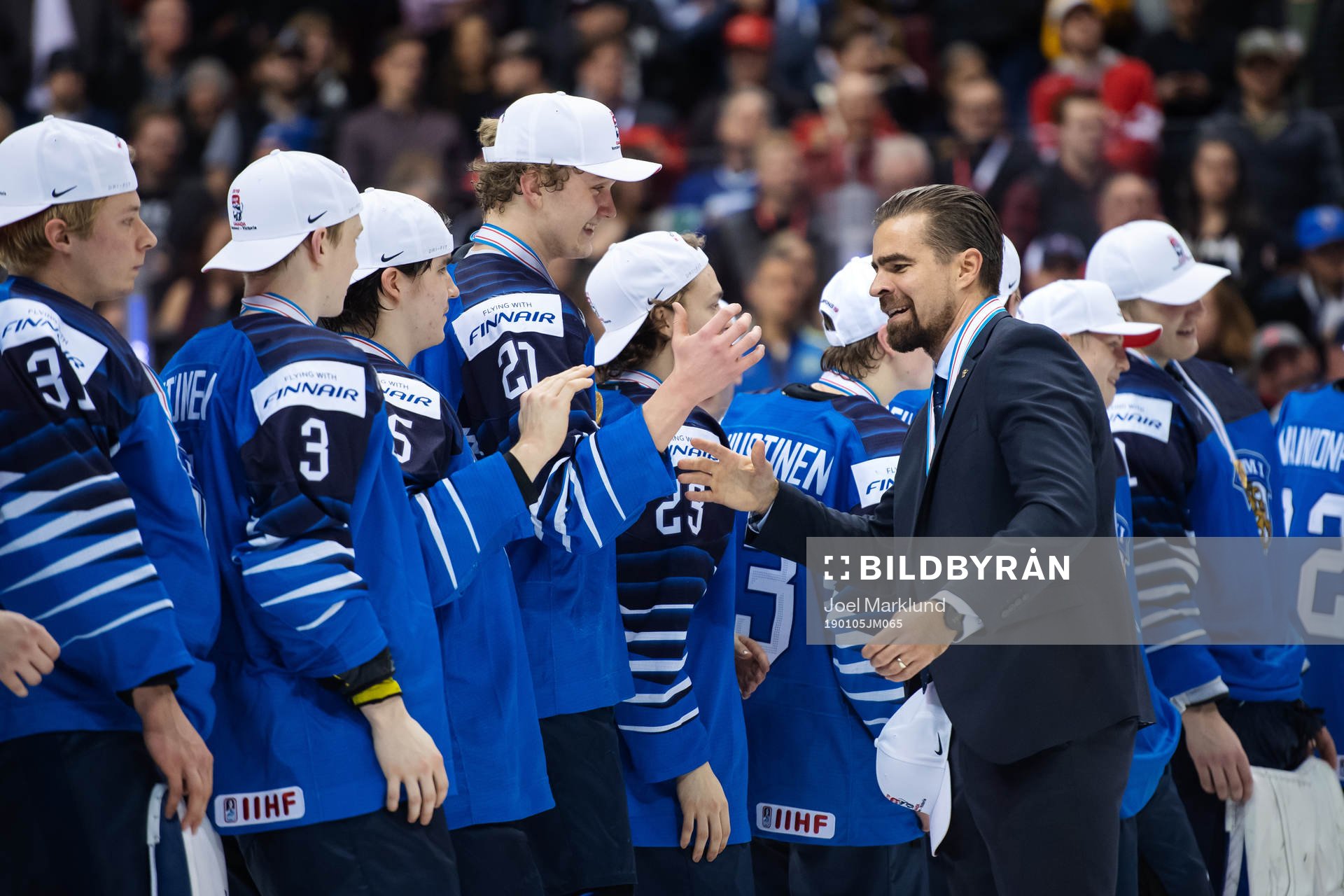Head coach Jussi Ahokas of Finland celebrates together with