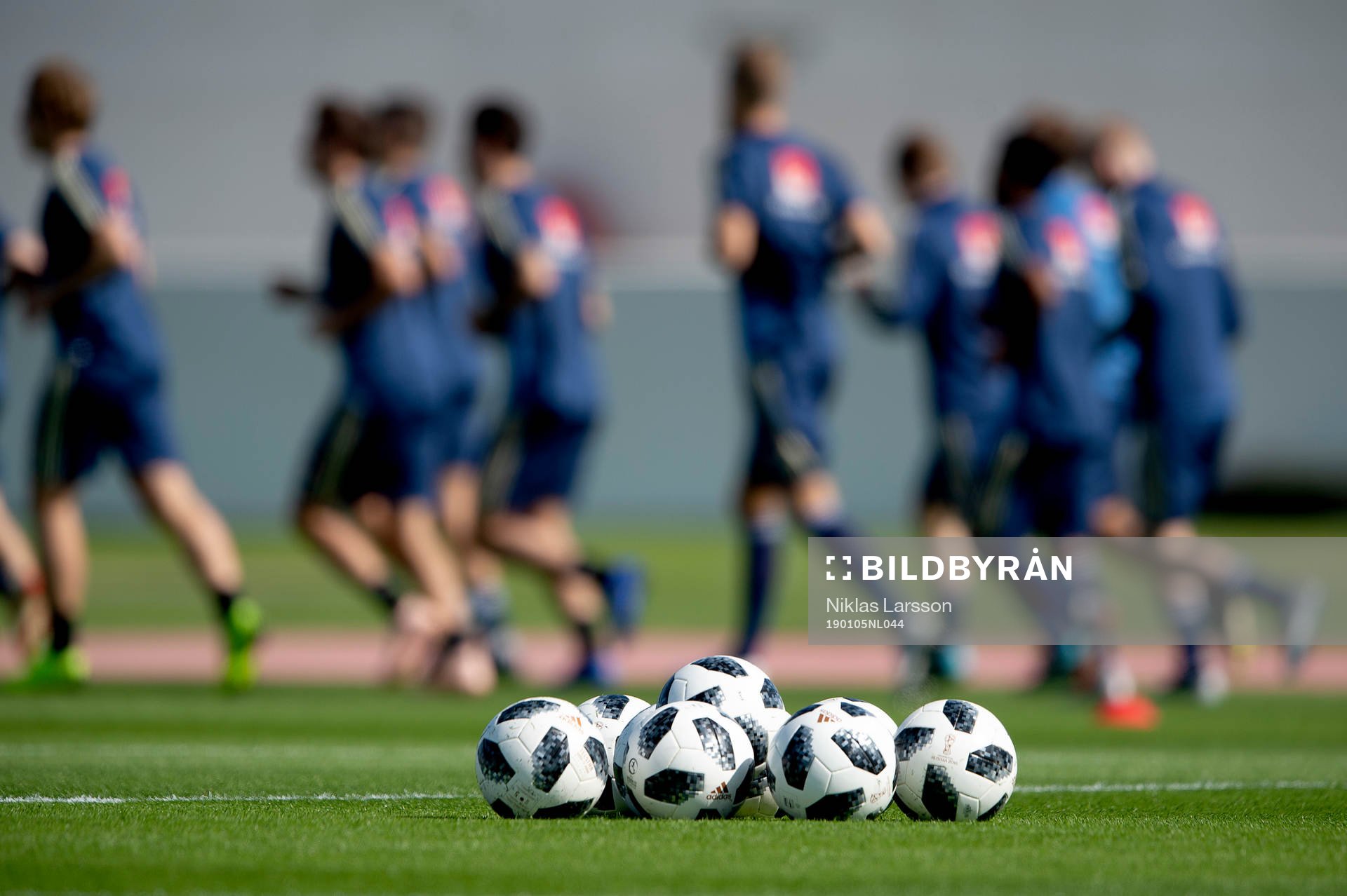 Sweden players in the background of a set of footballs