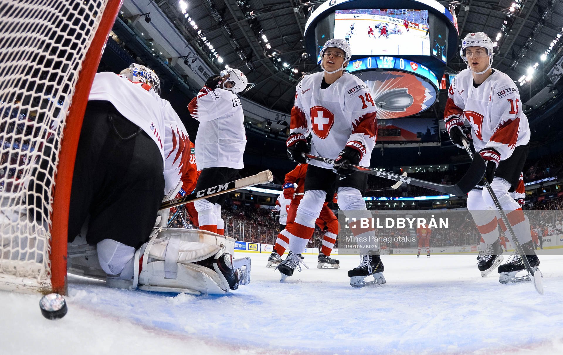 Switzerland's Luca Hollenstein #30, Sandro Schmid #14, and