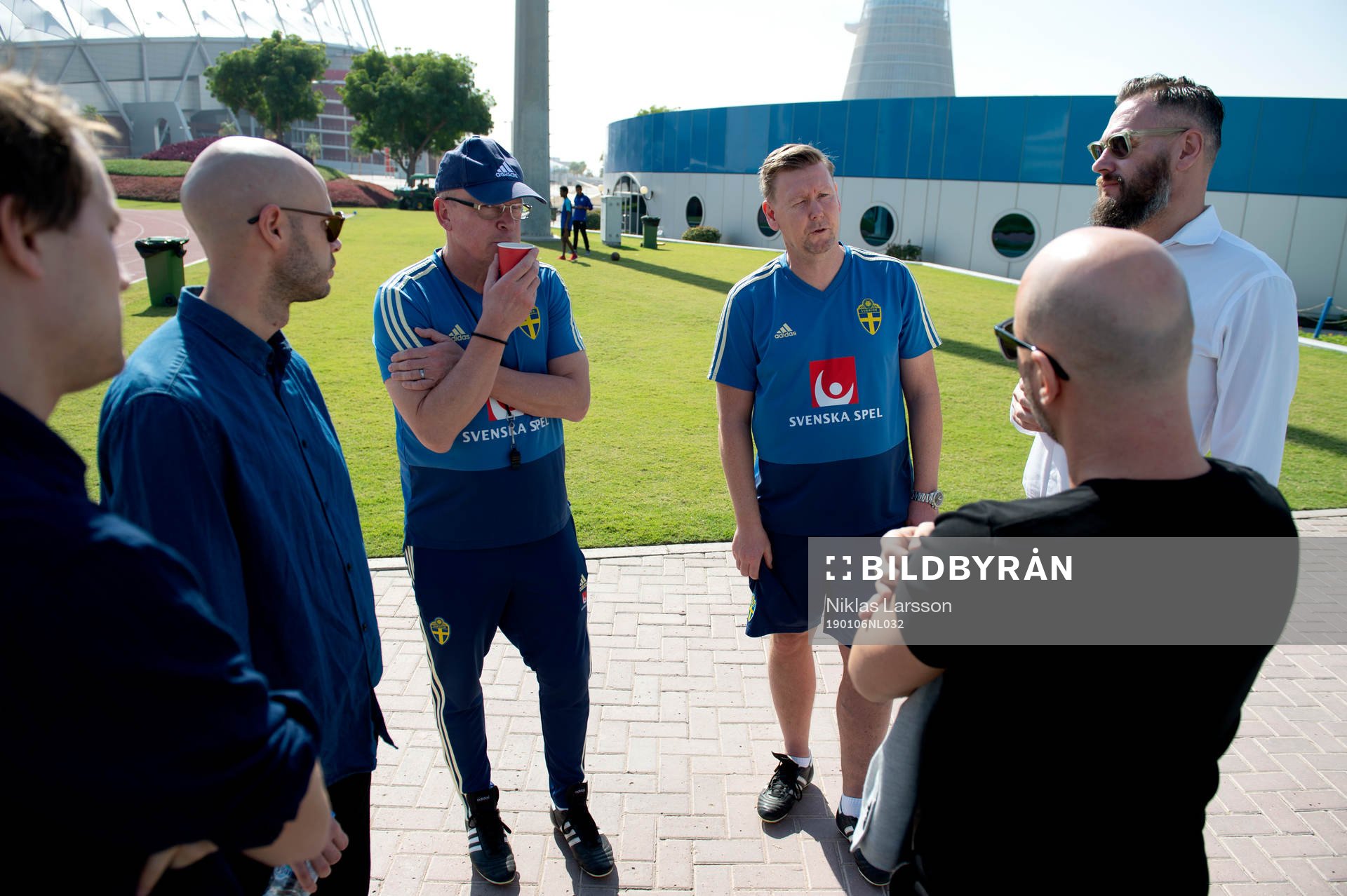 Sweden's head coach Janne Andersson and assistant coach Peter Wettergren talks with Swedish journalists during a training session on January 6, 2019 in Doha.