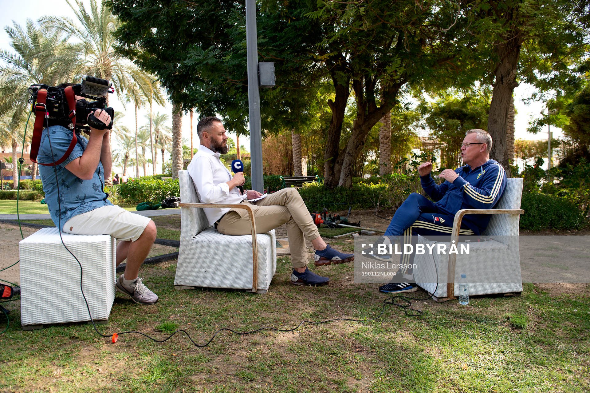 Journalist Olof Lundh interviews Sweden's head coach Janne