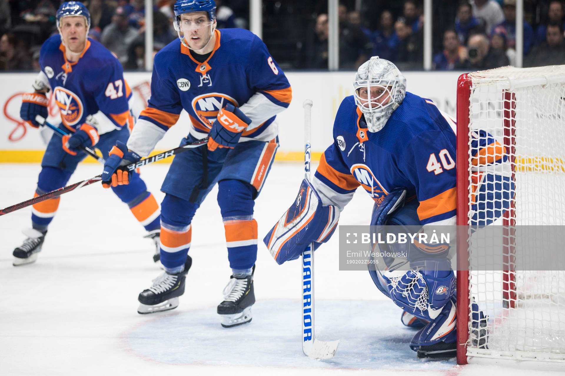 Leo komarov, Ryan Pulock and goalkeeper Robin Lehner of New