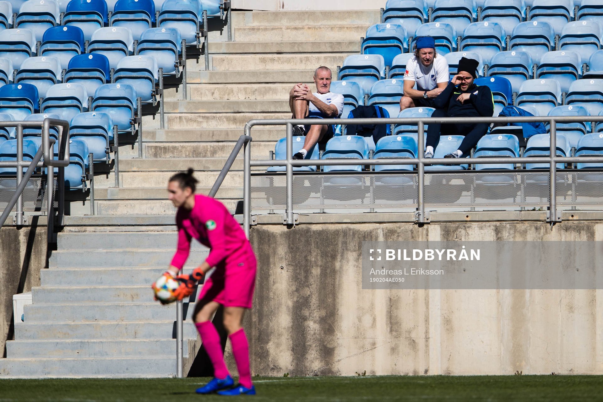 Norrköpings materialförvaltare Lennart Linder, players manager Mikael Hansson och Christoffer Nyman följer spelet under en träningsmatch i fotboll mellan SV Mattersburg och Norrköping den 4 februari 2019 i Faro.