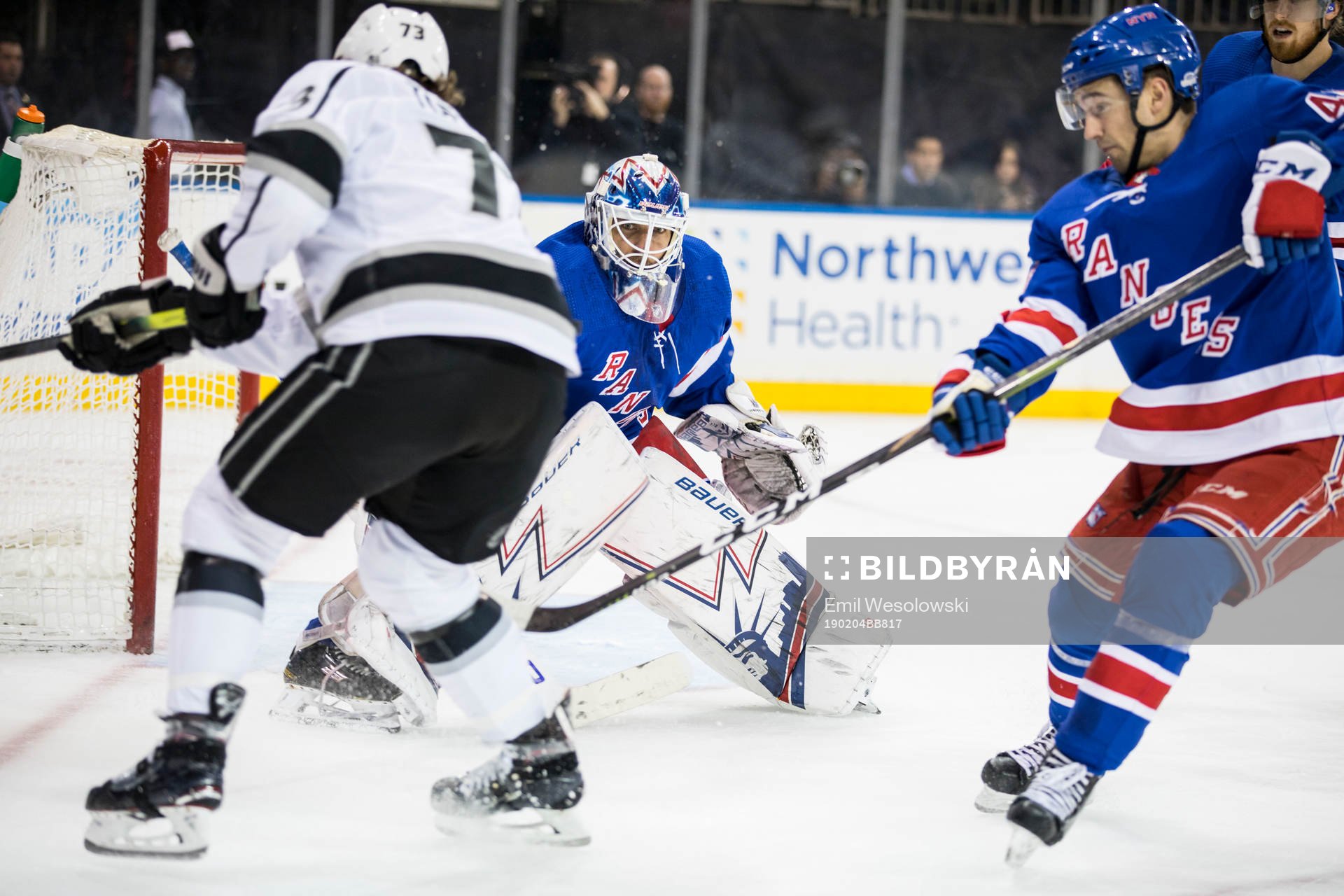 Oscar Fantenberg, Goaltender Henrik Lundqvist and Neal Pionk