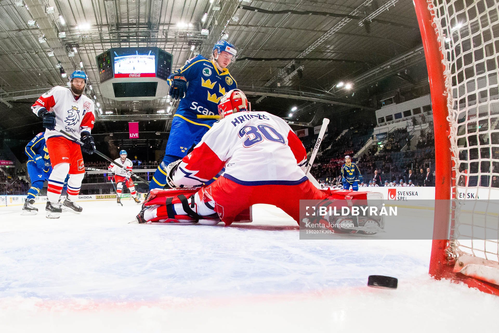 Emil Bemström of Sweden scores 0-1 behind goaltender Simon