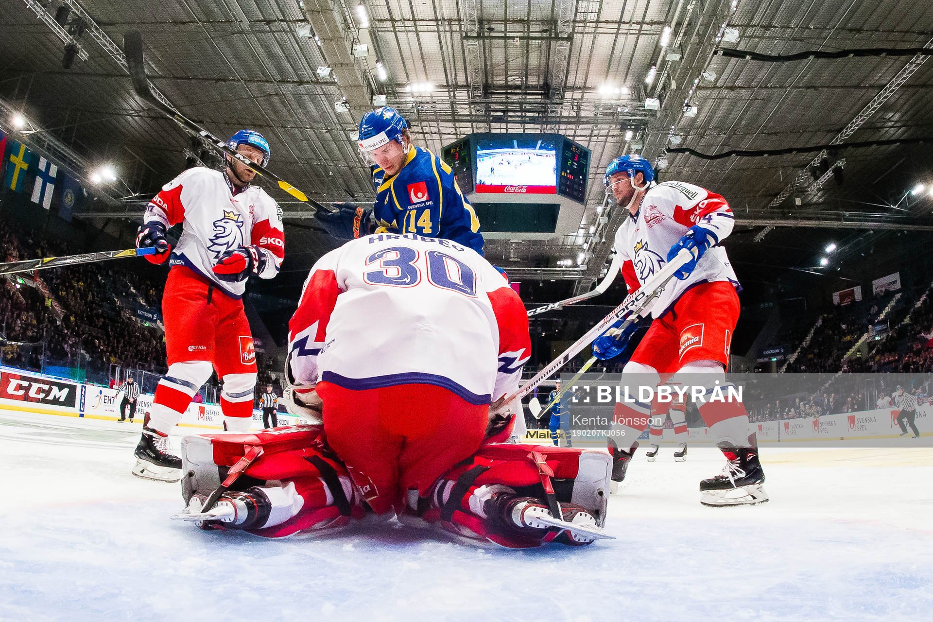 Jakob Lilja  of Sweden and goaltender Simon Hrubec of of