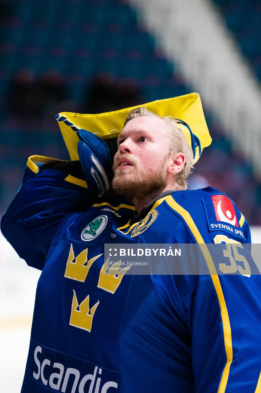 goaltender Magnus Hellberg of Sweden looks dejected