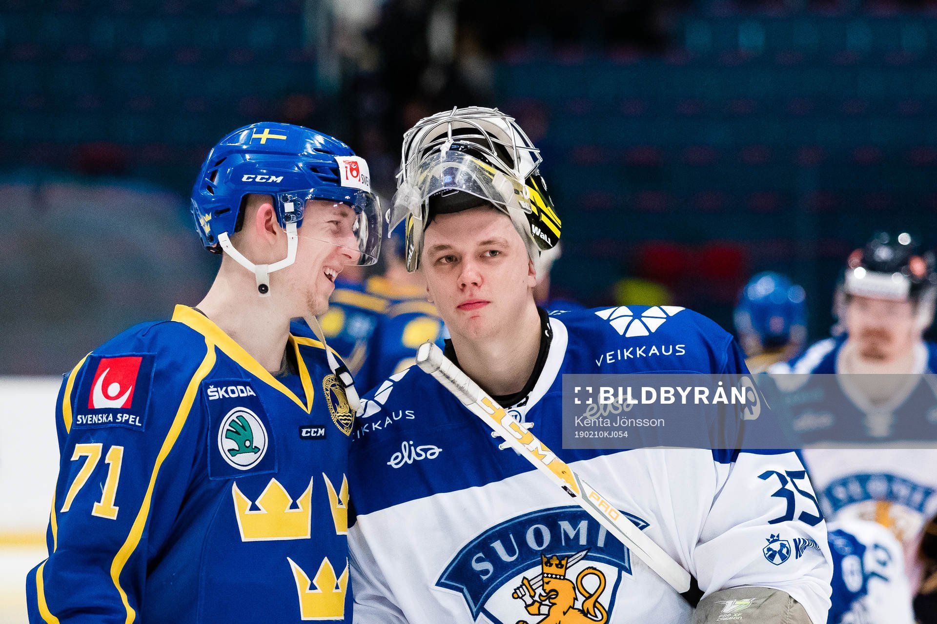 Jonathan Davidsson of Sweden and  goaltender Veini