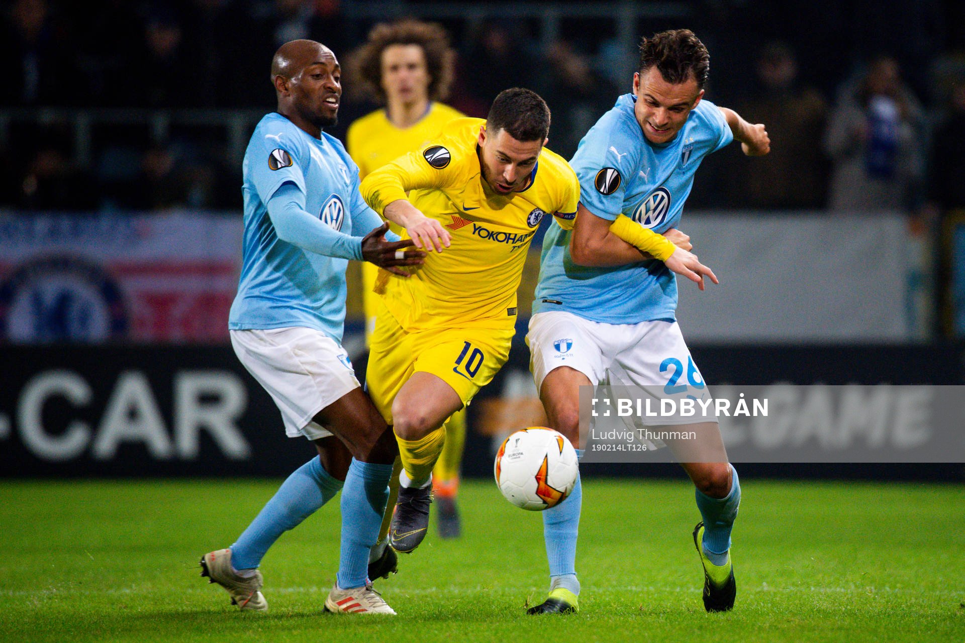 Eden Hazard fights for the ball with Fouad Bachirou and