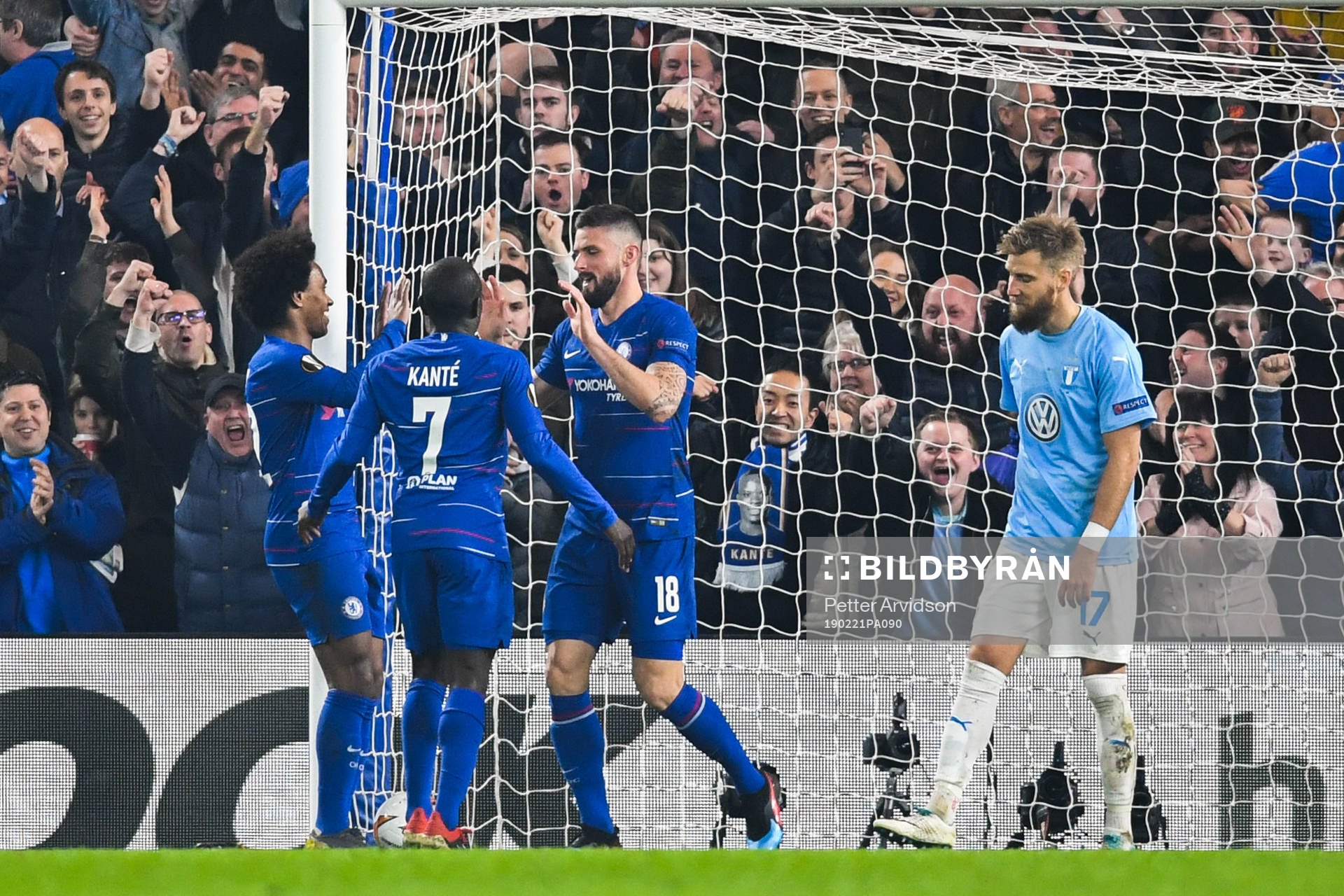 Olivier Giroud celebrates with Willian and N'Golo Kante of