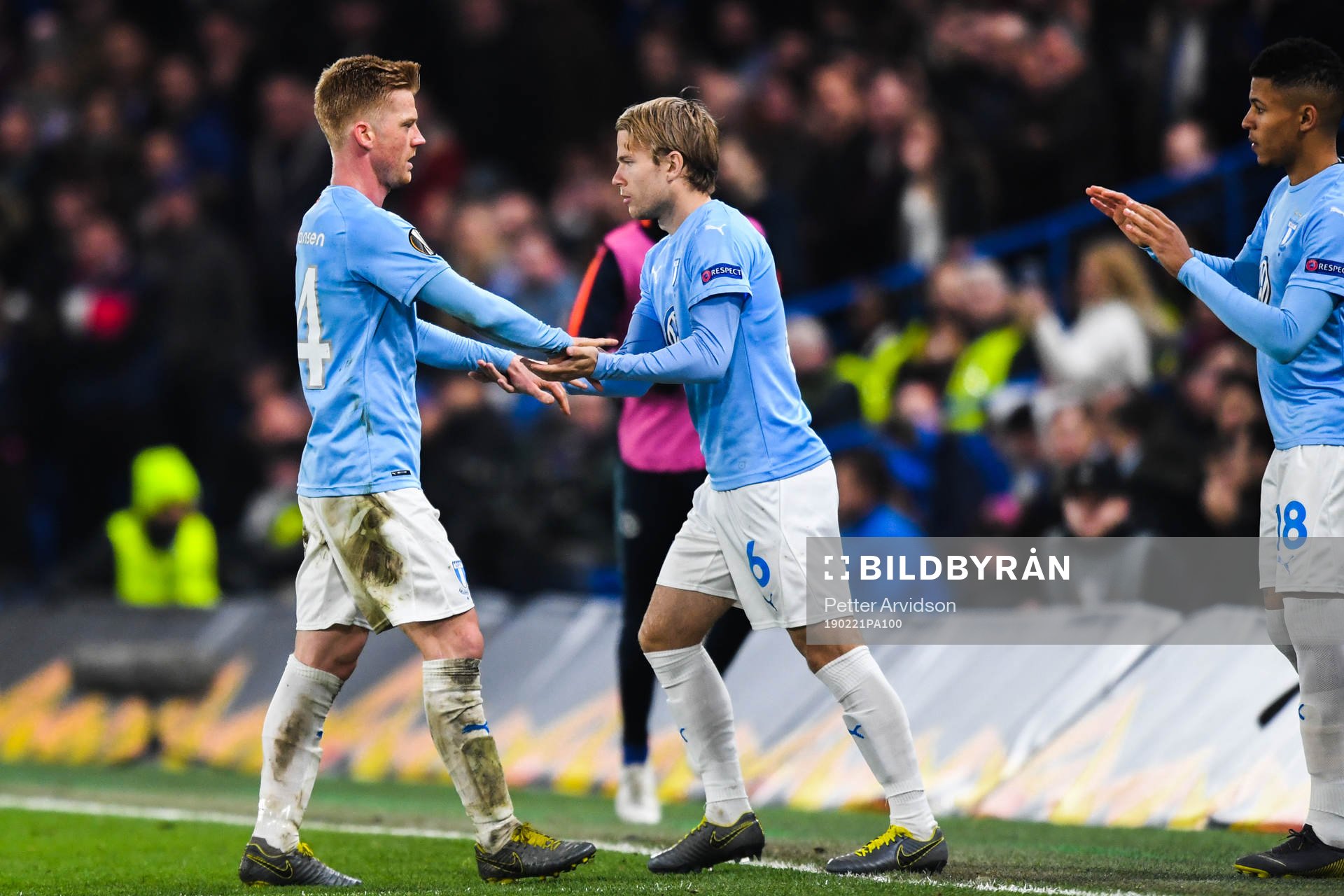 Anders Christiansen changes with Oscar Lewicki of Malmö FF during the Europa league match between Chelsea and Malmö FF on February 21, 2019 in London.