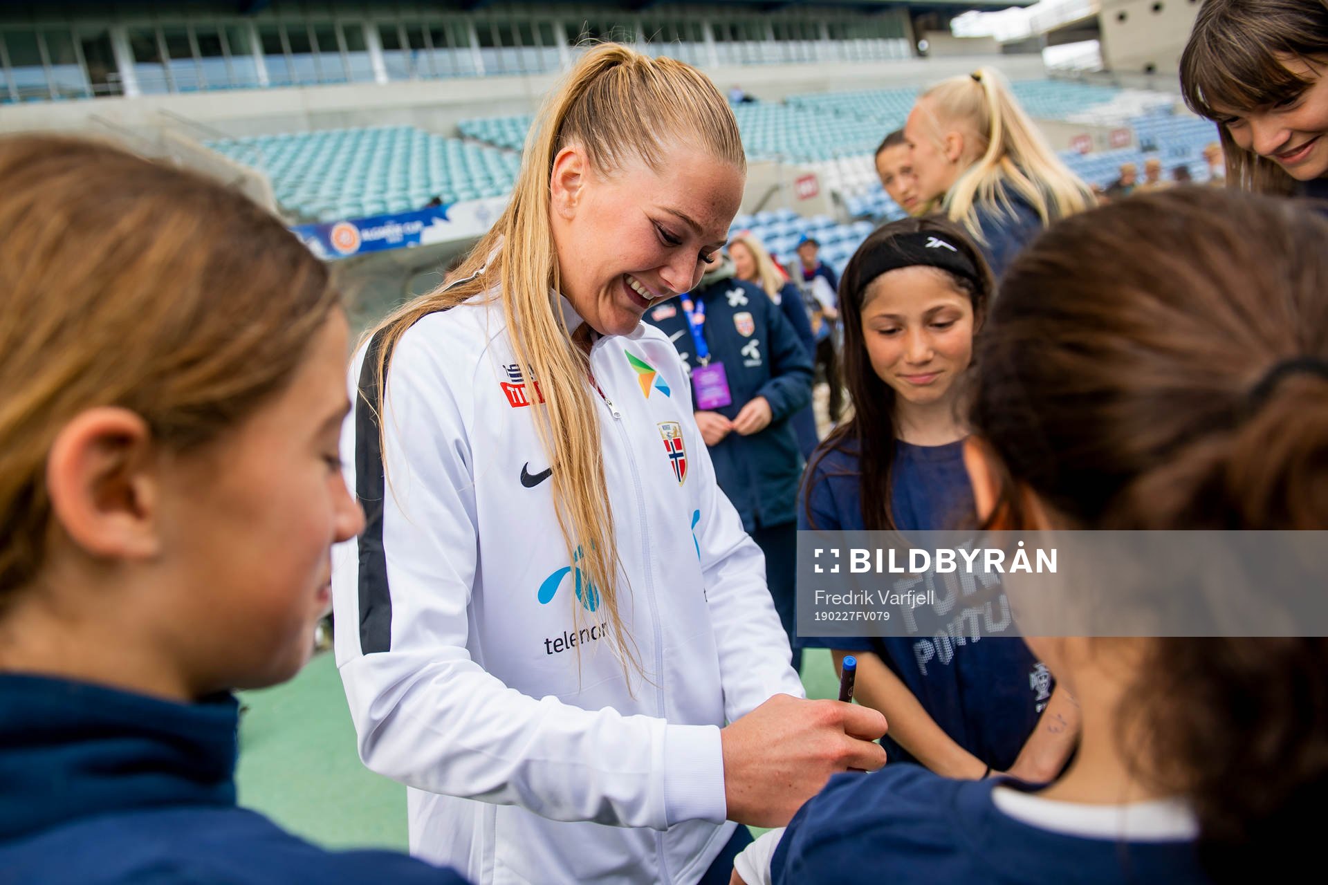 Lisa-Marie Karlseng Utland of Norway writes autographs