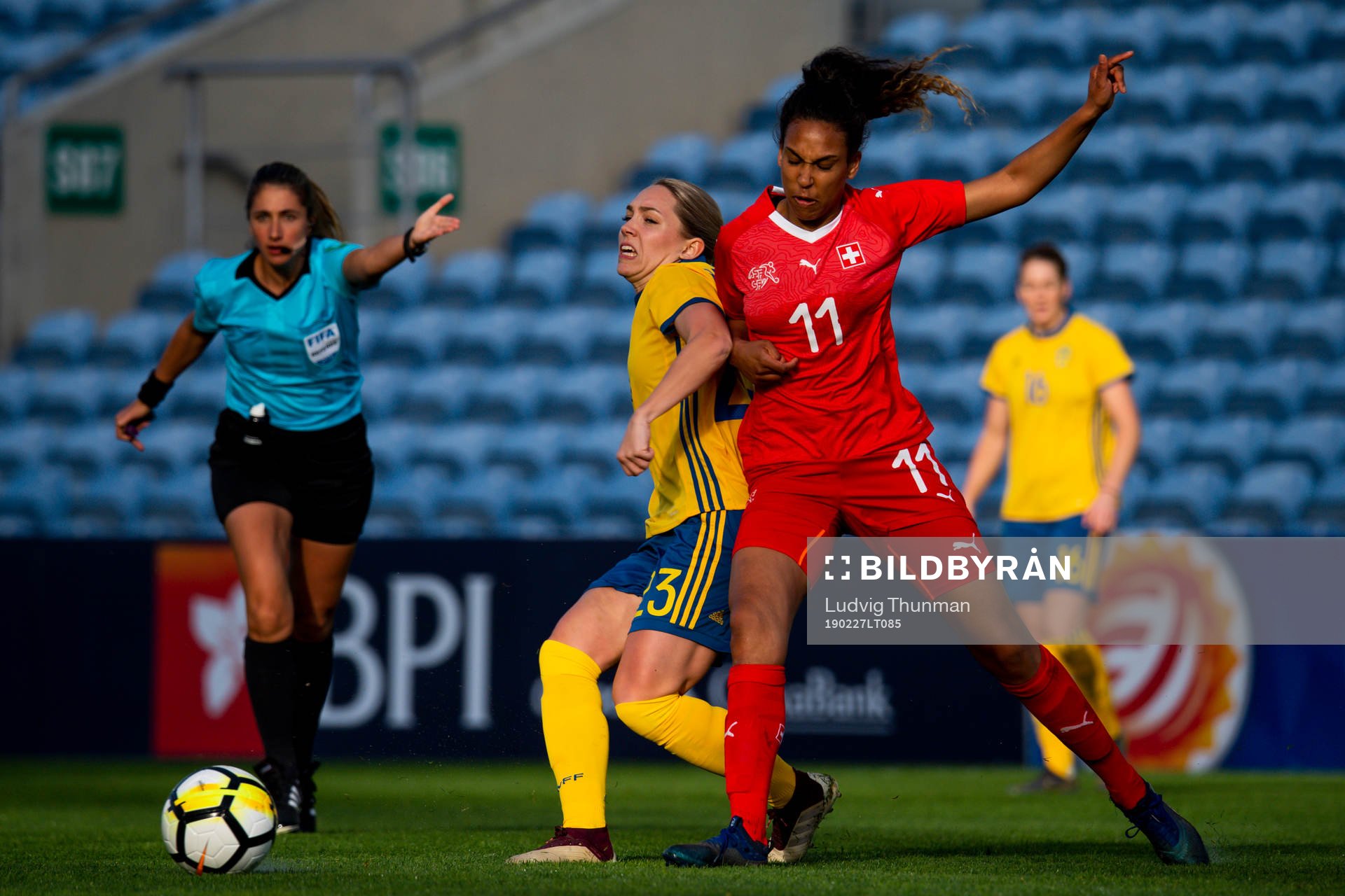 Elin Rubensson of Sweden fights for the ball with Louisa