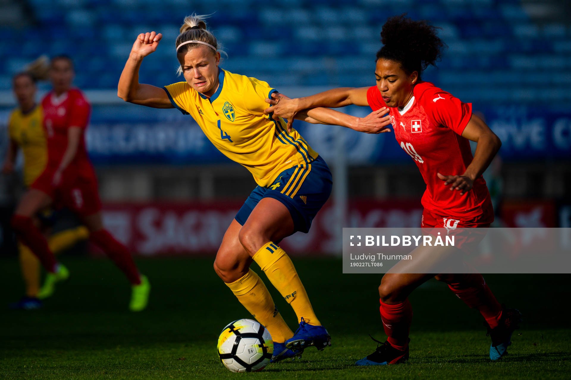 Hanna Glas of Sweden fights for the ball with Eseosa