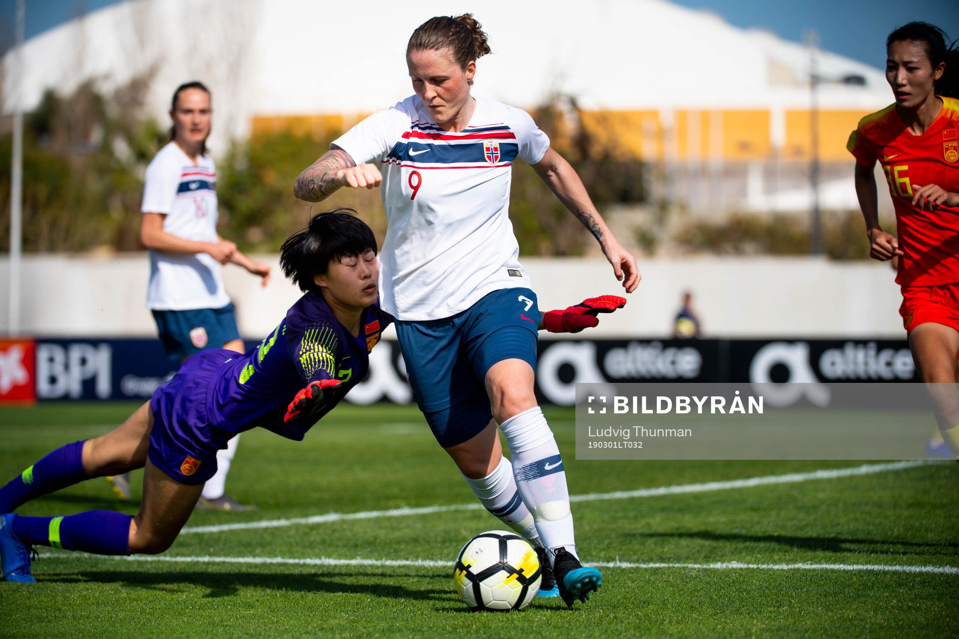Isabell Herlovsen of Norway and goalkeeper Wang Shimeng of