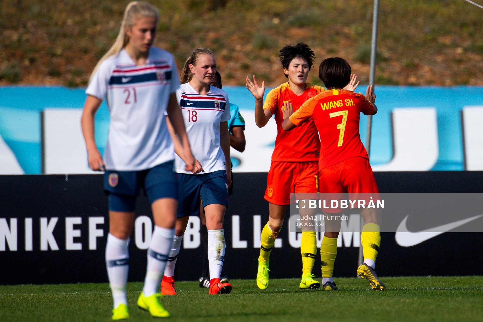 Wang Shanshan of China celebrates with her teammates