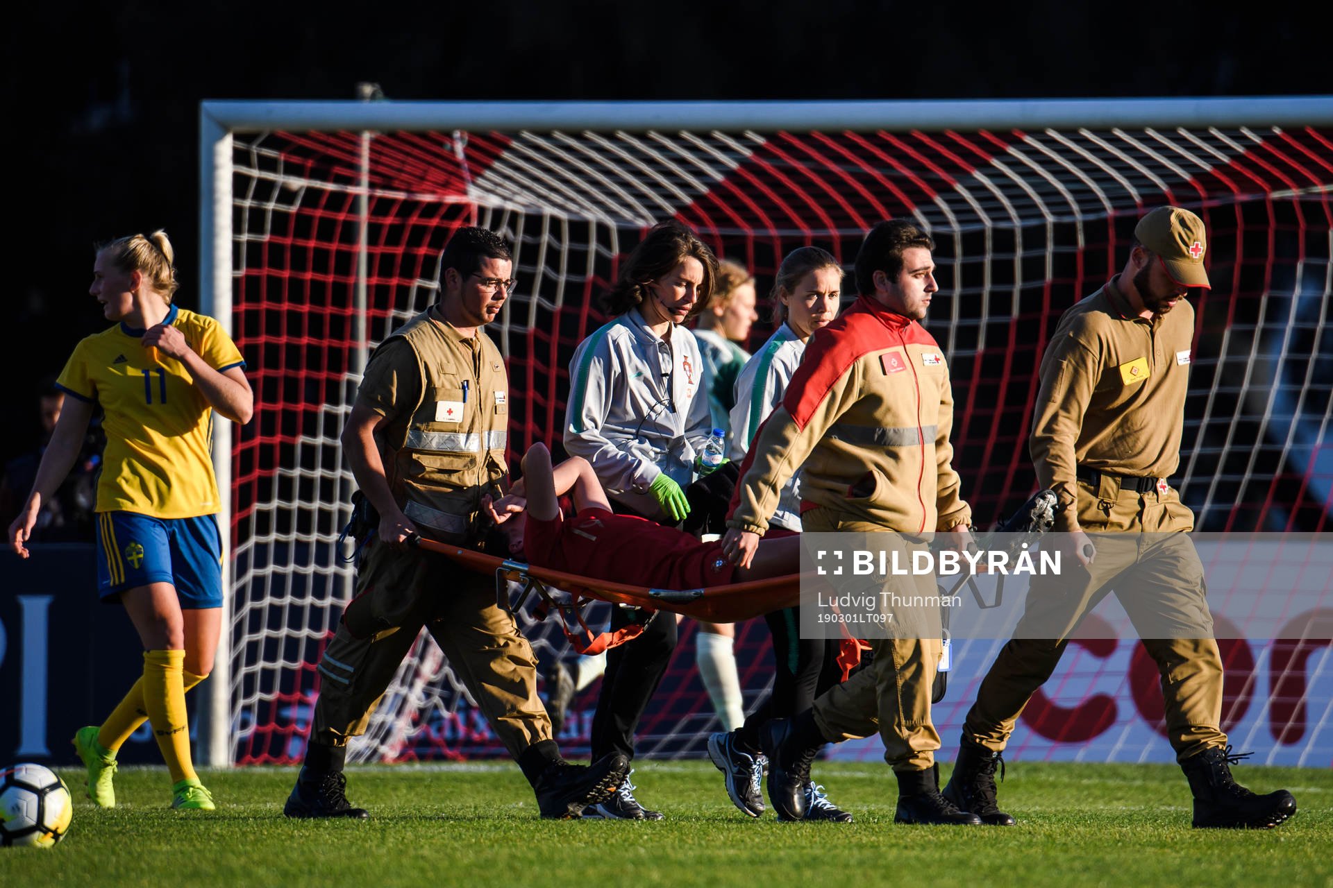 Ana Caoeta of Portugal is carried of the pitch