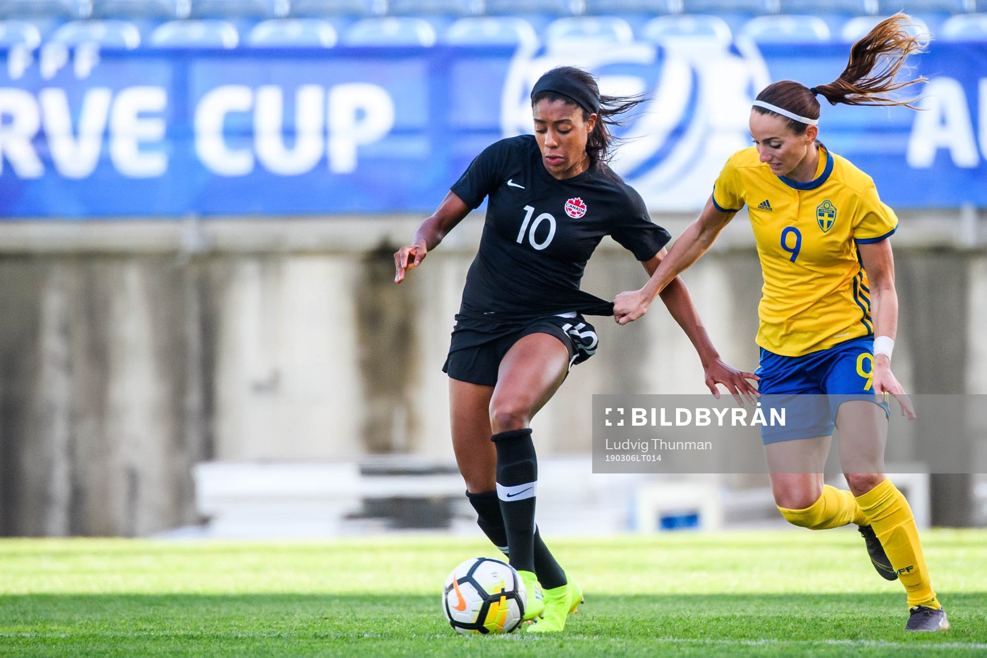 Ashley Lawrence of Canada and Kosovare Asllani of Sweden