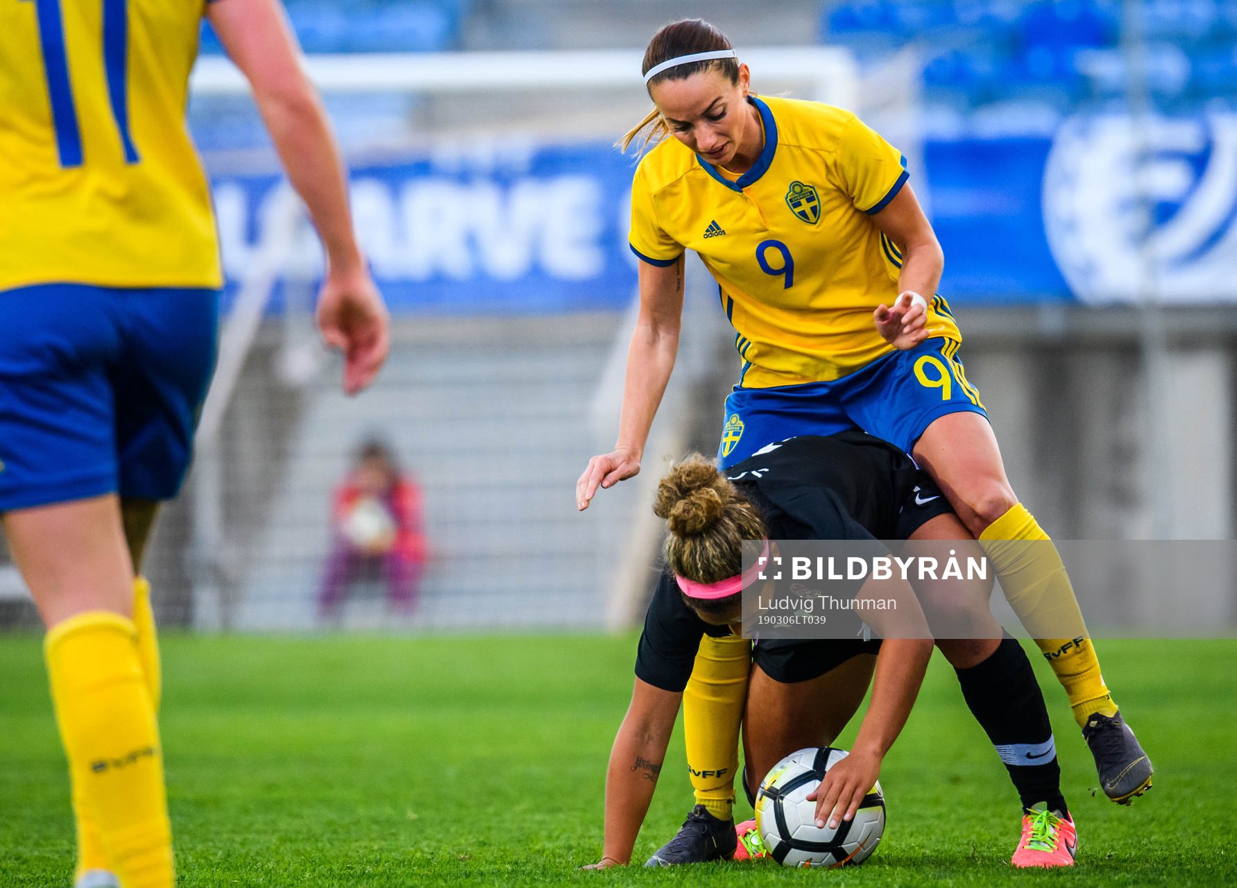 Kosovare Asllani of Sweden and Desiree Scott of Canada