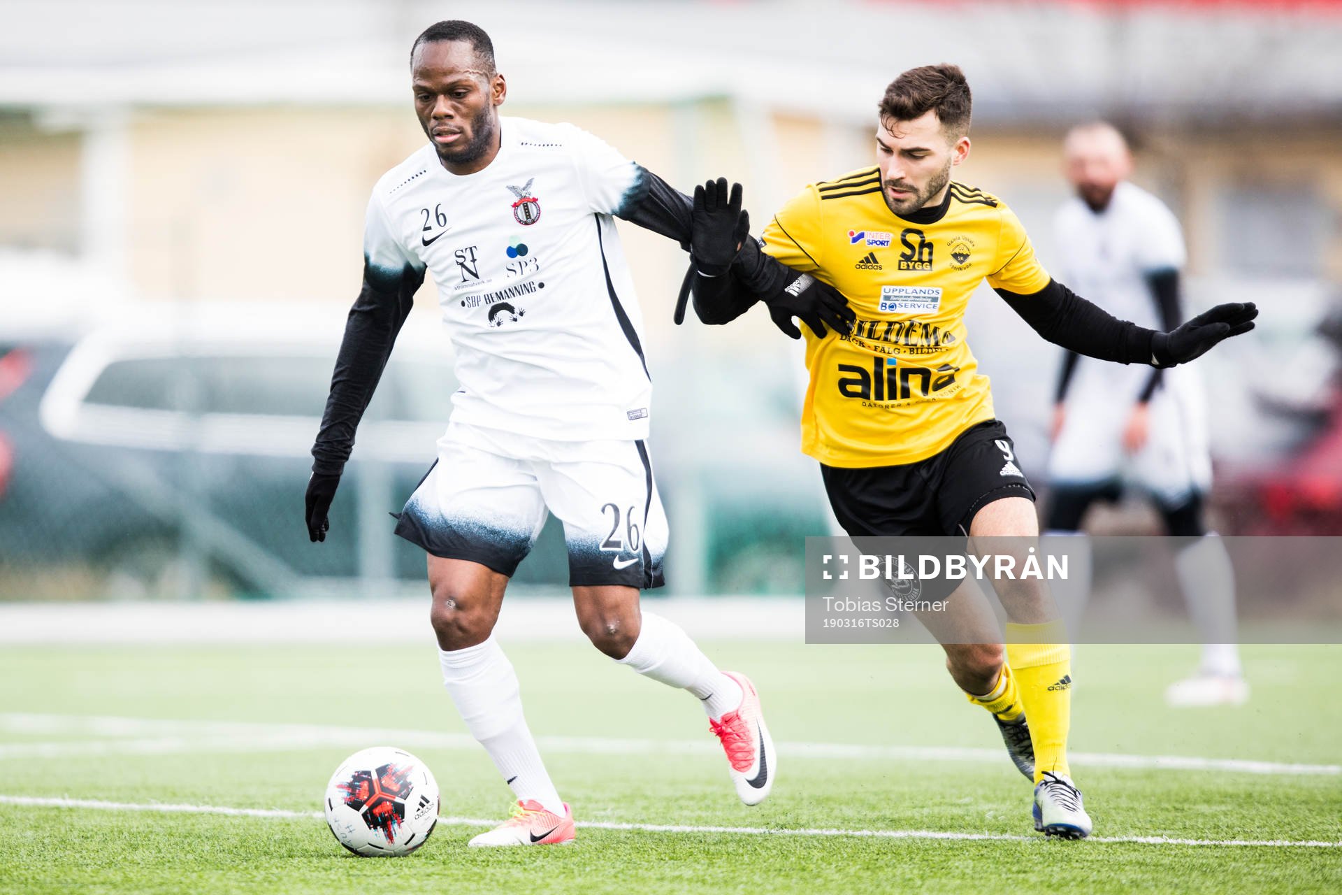FC Stockholm Internatzionales Mtaka Simba och Gamla Upsalas Dennis Kumric under träningsmatchen i fotboll mellan Gamla Upsala och FC Stockholm Internazionale den 16 mars 2019 i Uppsala.
