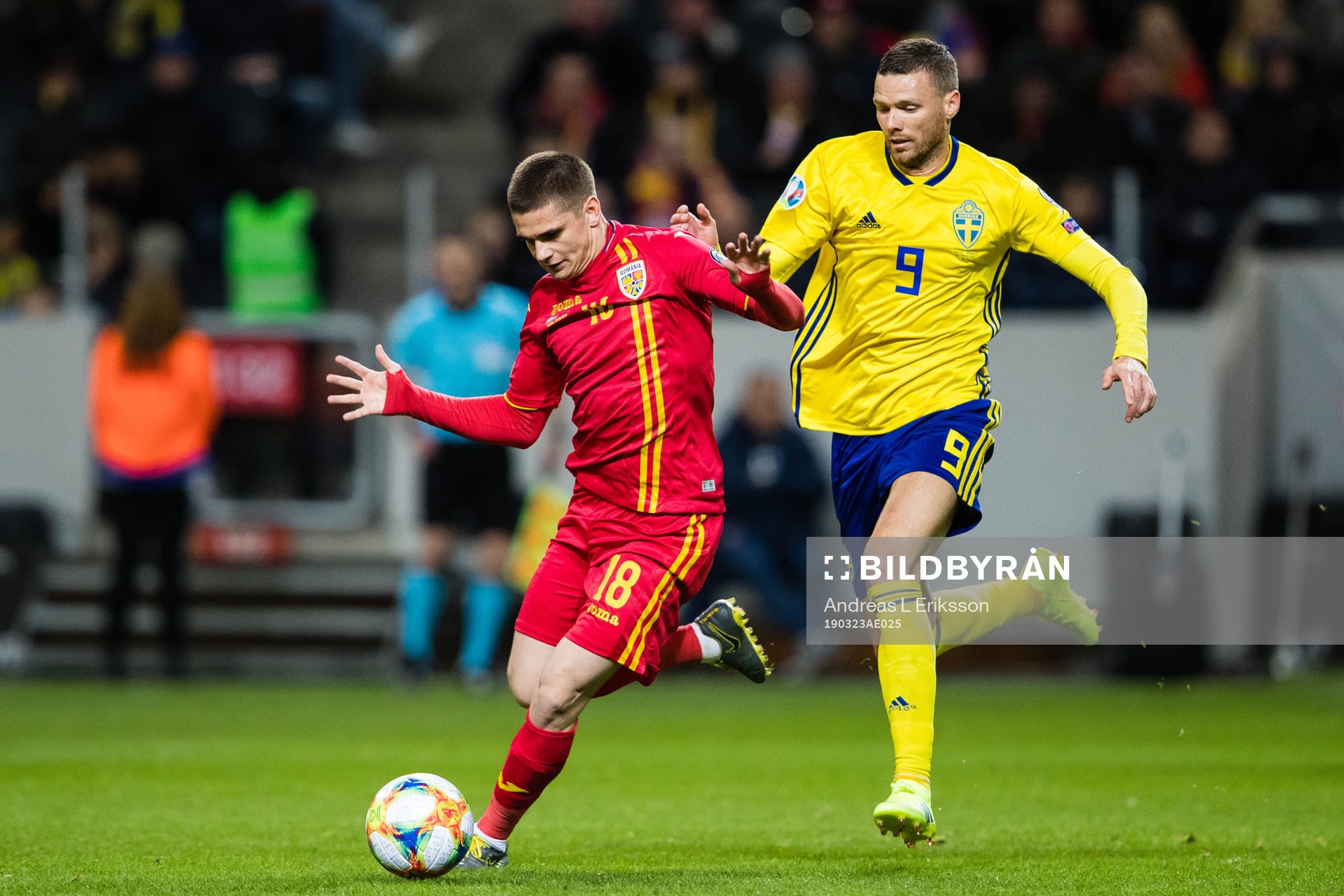 Razvan Marin of Romania and Marcus Berg of Sweden competes
