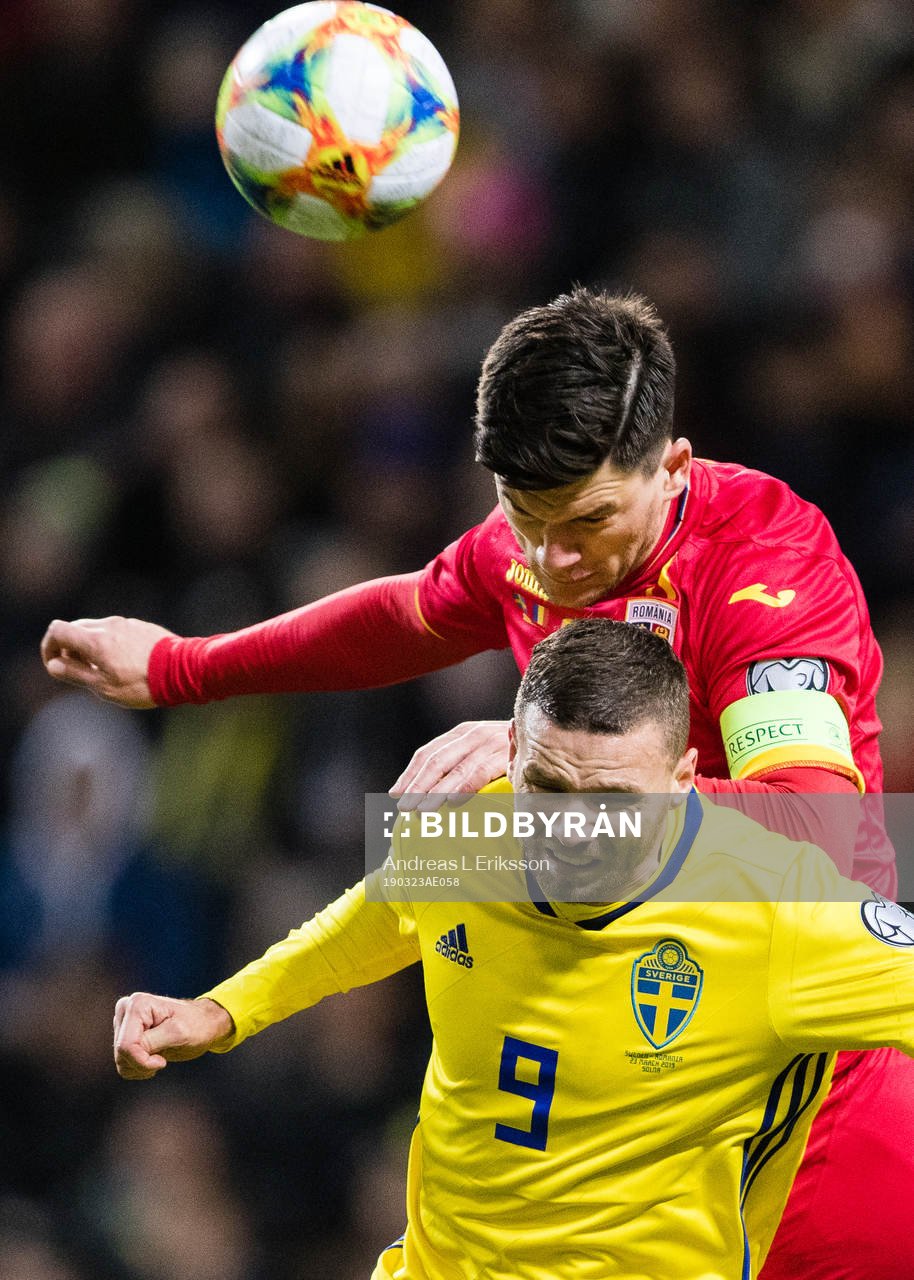 Marcus Berg of Sweden and Cristian Sapunaru of Romania
