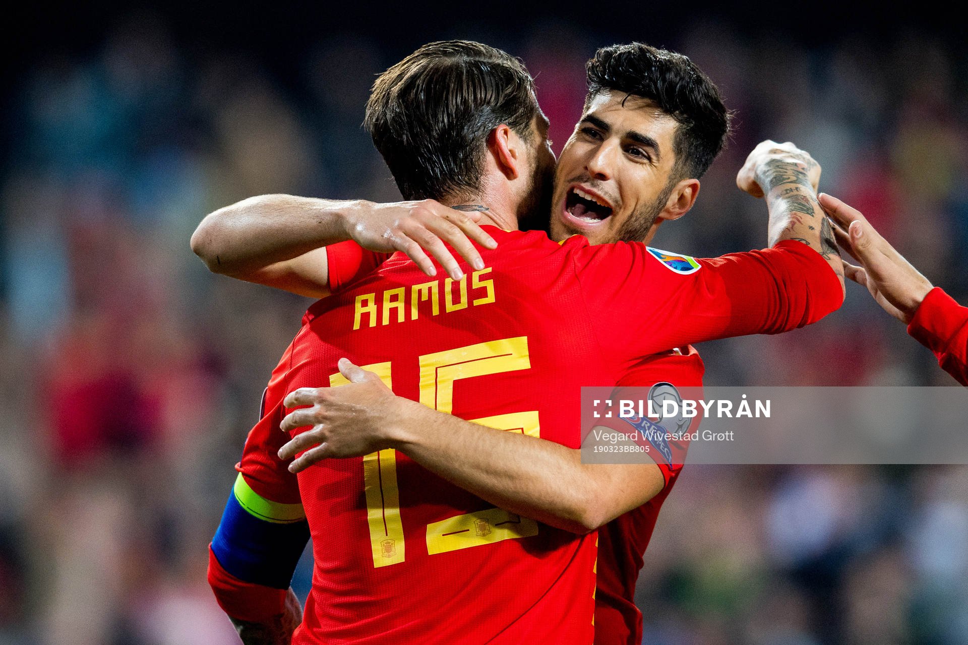 Sergio Ramos of Spain celebrates with teammate Marco Asensio after scoring 2-1 on a penalty kick during the UEFA Euro Qualifier football match between Spain and Norway on March 23, 2019 in Valencia.