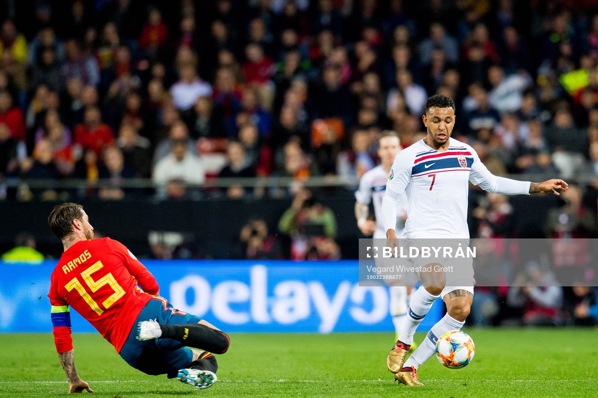 Sergio Ramos of Spain and Joshua King of Norway