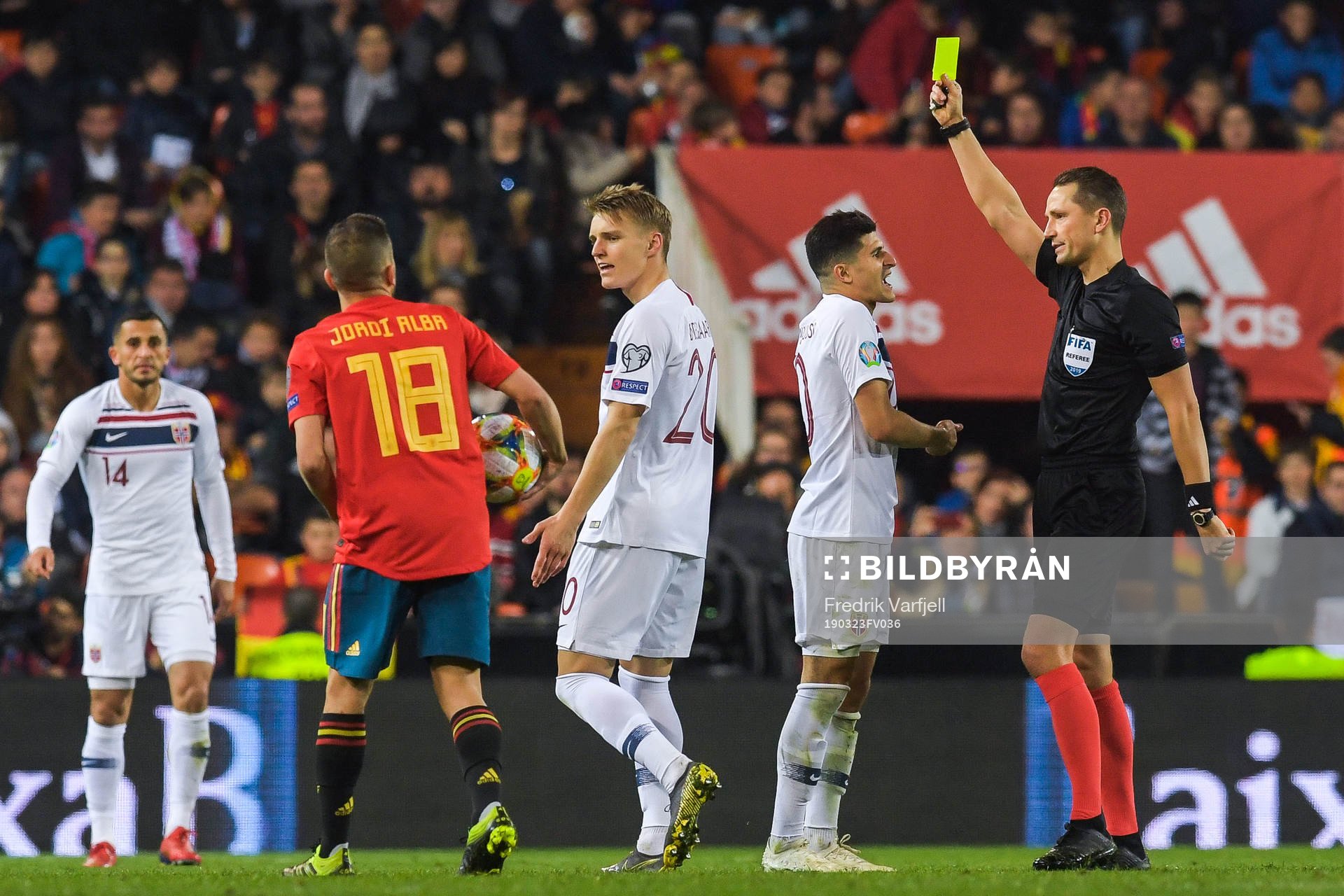 Tarik Elyounoussi of Norway receives a yellow card