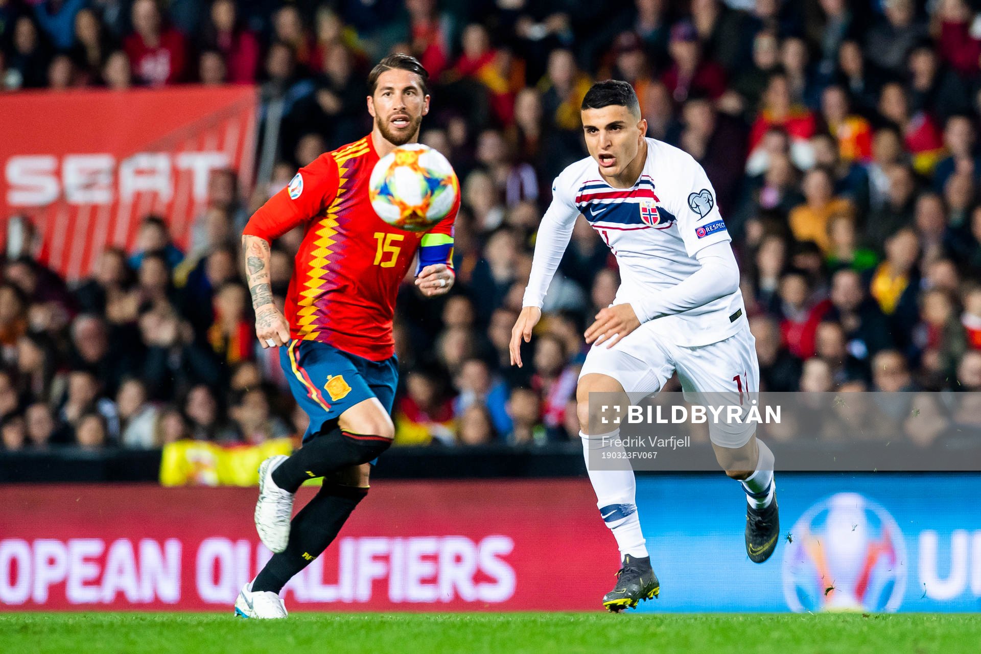 Sergio Ramos of Spain and Mohamed Elyounoussi of Norway