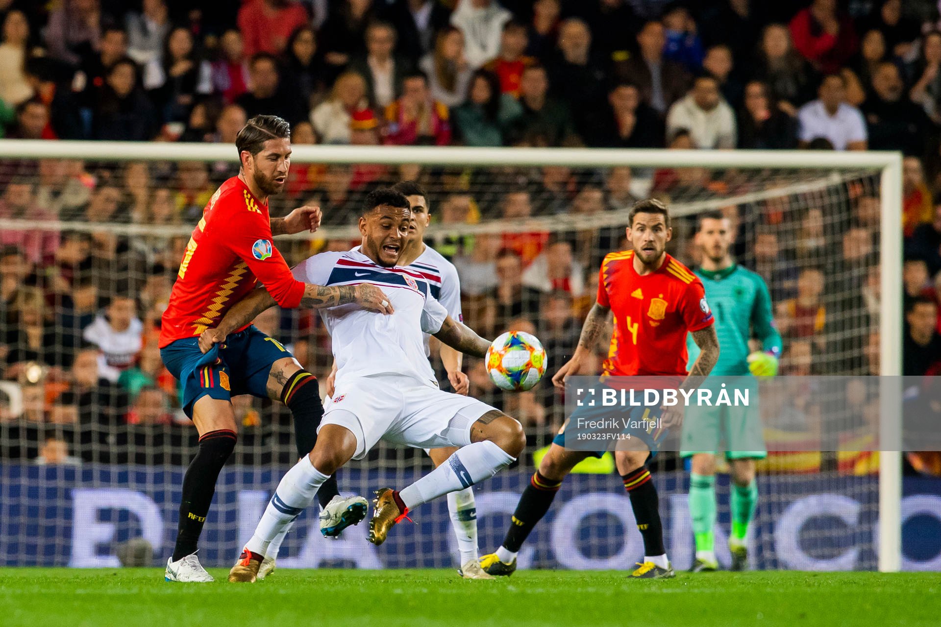 Sergio Ramos of Spain and Joshua King of Norway