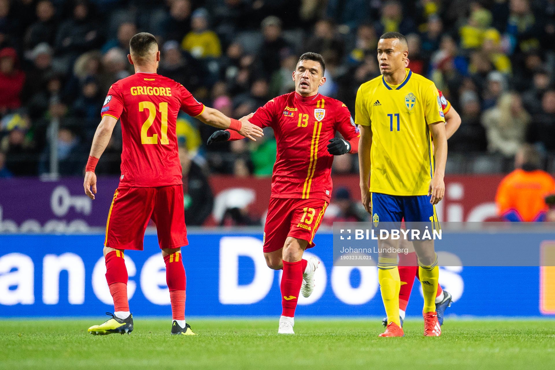 Claudiu Keseru of Romania celebrates scoring 1-2, while