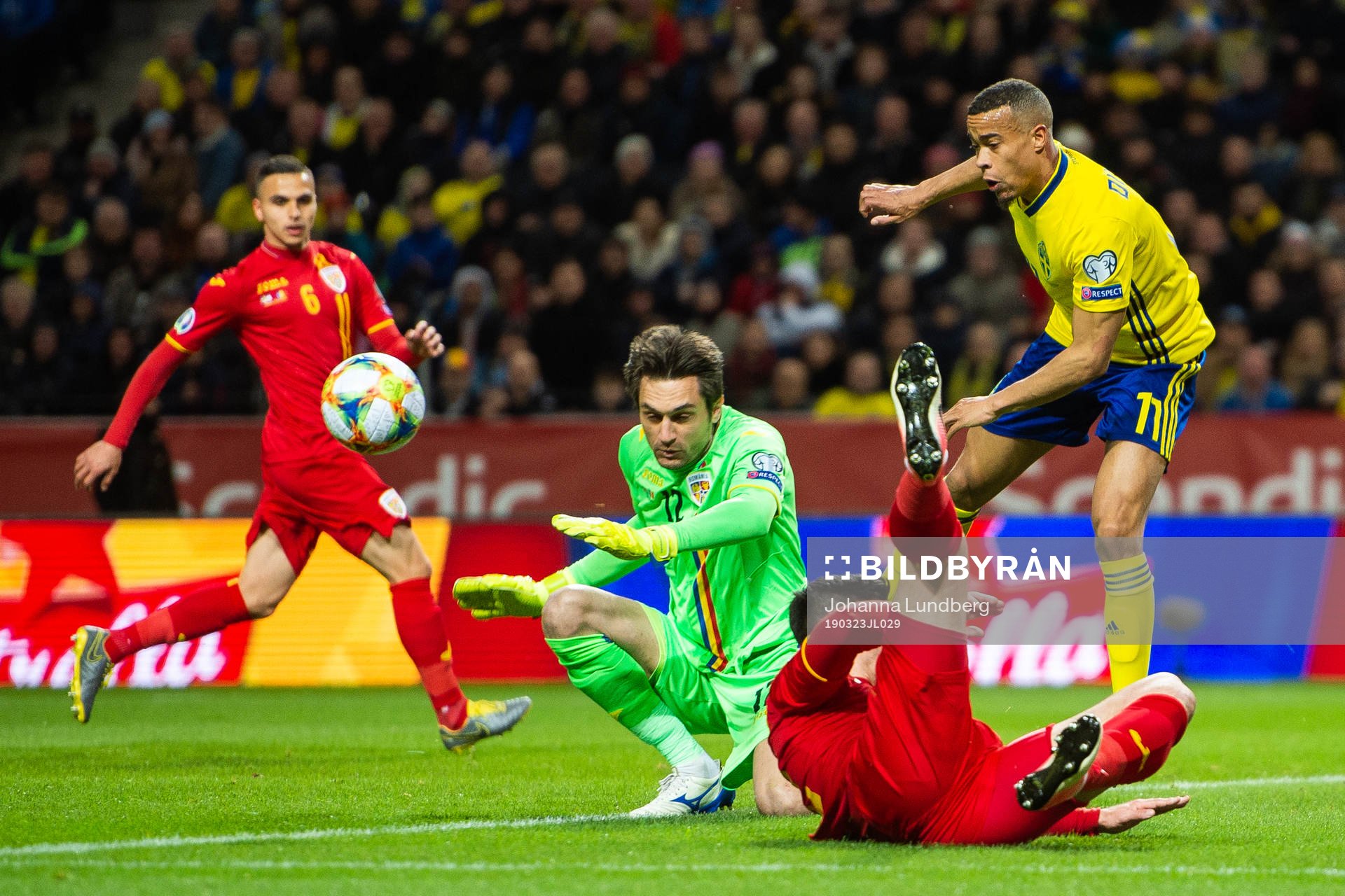 Robin Quaison of Sweden against goalkeeper Ciprian