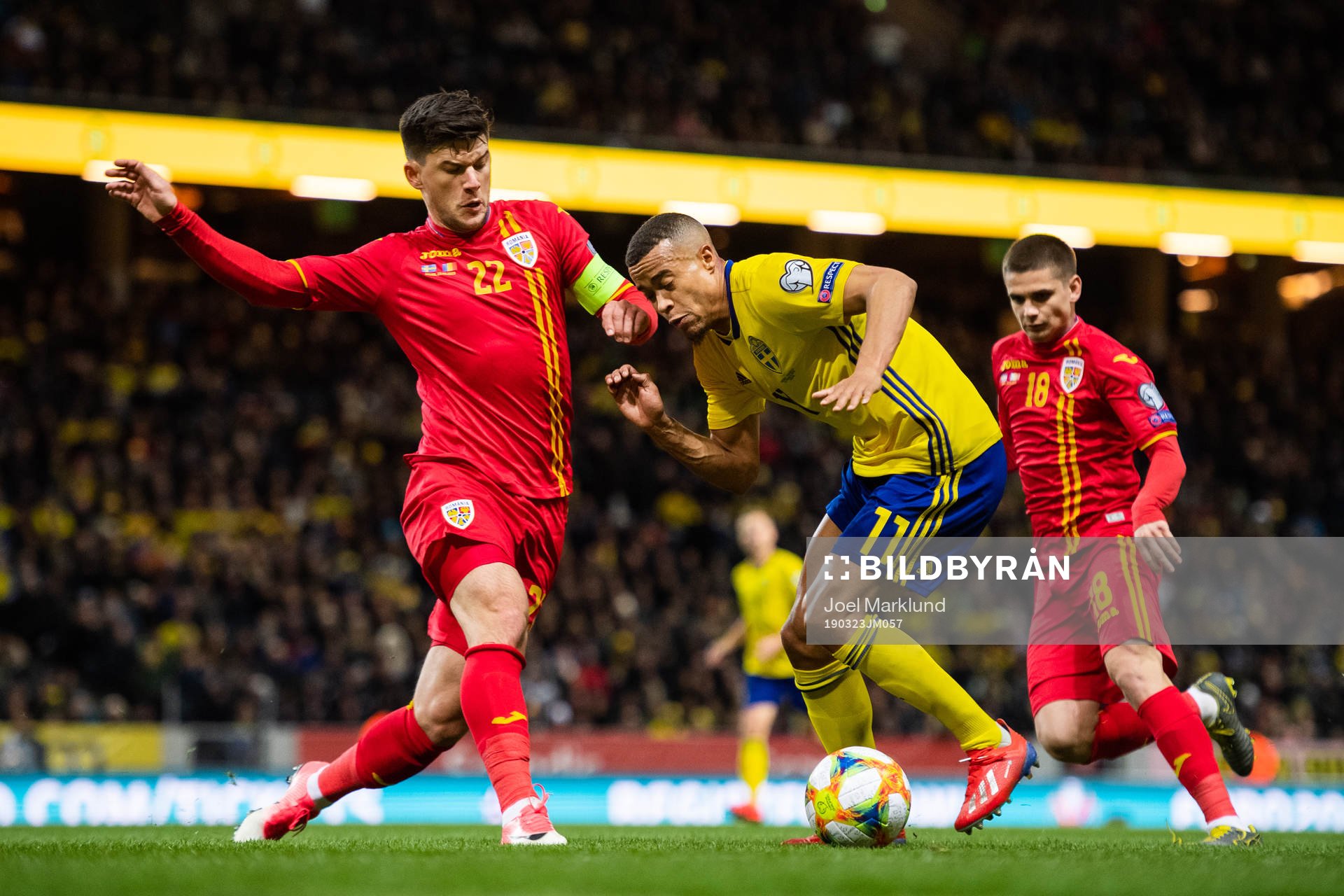 Robin Quaison of Sweden and Cristian Sapunaru of Romania