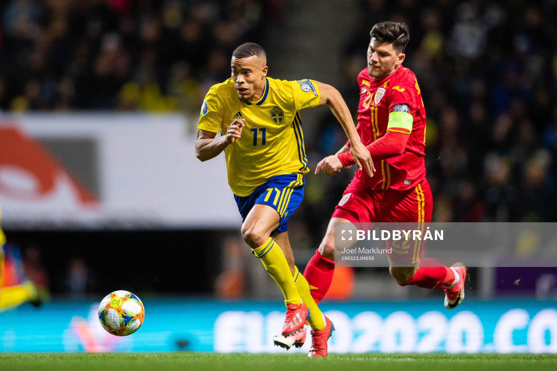 Robin Quaison of Sweden and Cristian Sapunaru of Romania